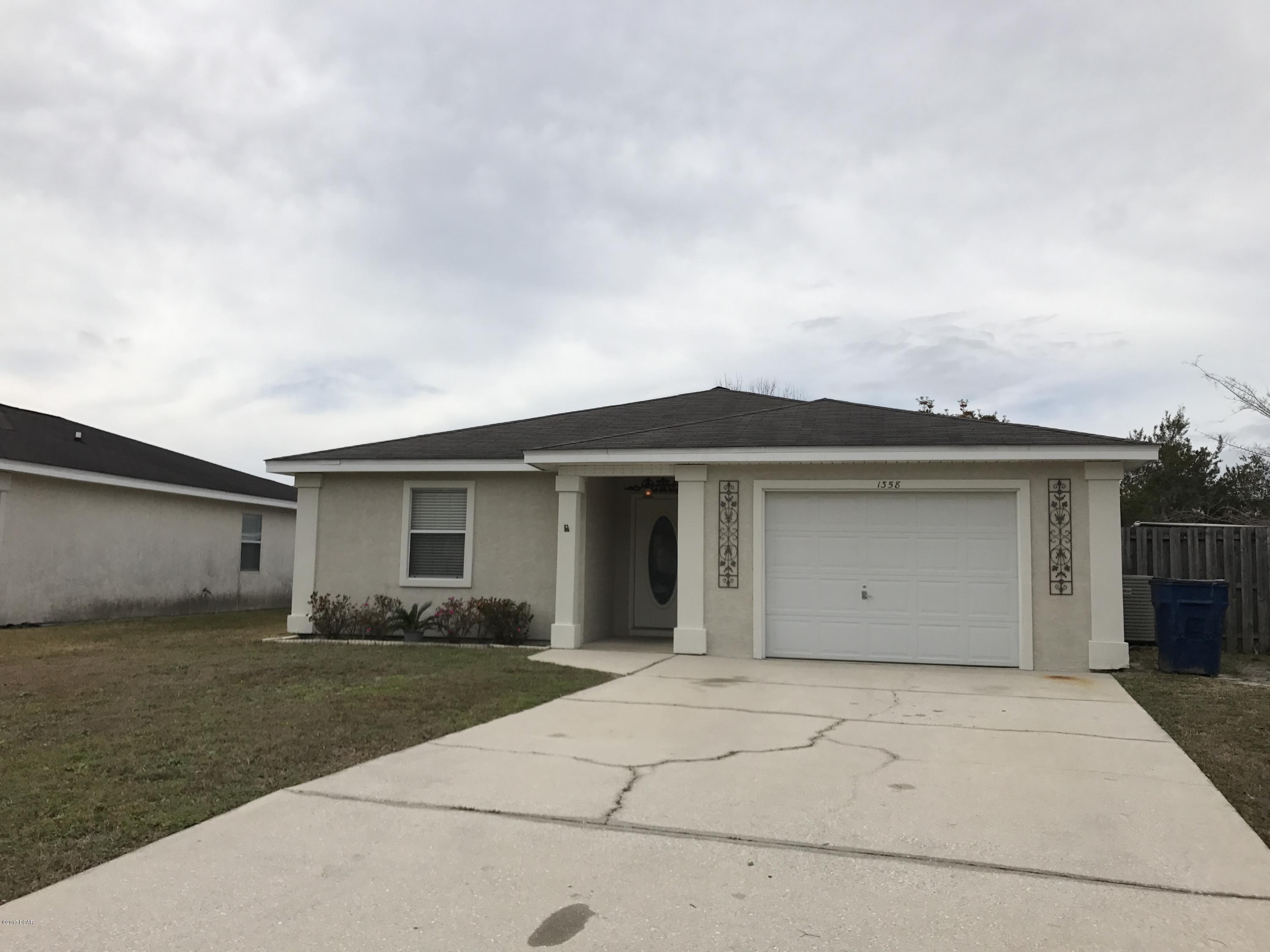 Extremely well kept home in the Venetian Villa area.  This 3 bedroom 2 bath home features all tile floors, open kitchen, dining, and living room with french doors leading out to a covered patio and fenced back yard.