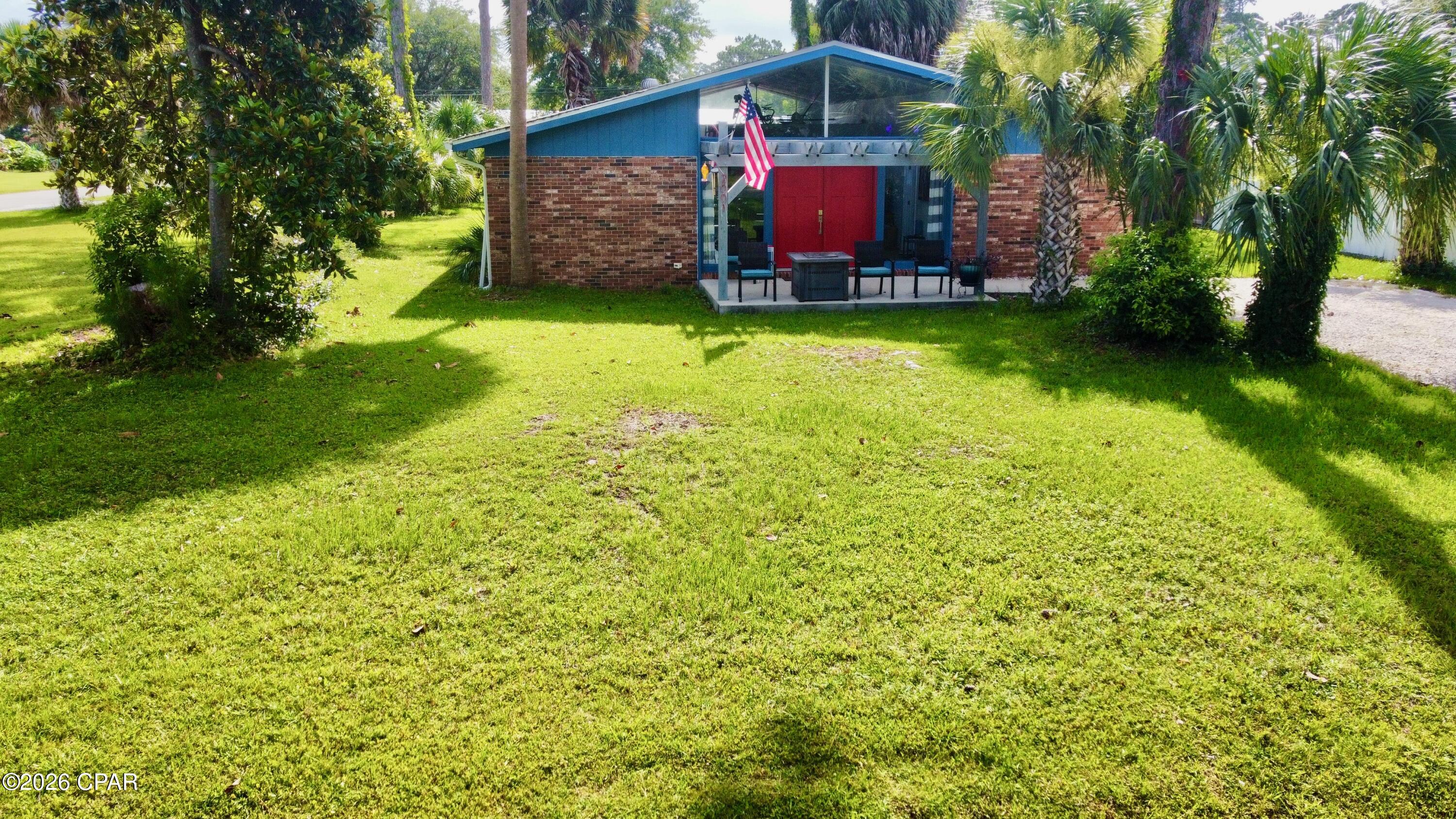 Welcome to 2001 Palm Boulevard, where coastal convenience meets comfortable living in one of Port St. Joe's most desirable locations. Situated just moments from the waters of St. Joseph Bay and a short golf cart ride to historic downtown Port St. Joe, this property offers the ideal blend of recreation, relaxation, and everyday convenience. Designed with both functionality and comfort in mind, the home features an inviting open-concept floor plan filled with natural light. The spacious living area showcases beautiful vaulted ceilings with exposed beams, creating an airy and welcoming atmosphere that is perfect for entertaining family and friends. Updated appliances complement the kitchen, while the split-bedroom design provides privacy and separation between the owner's suite and guest accommodations. Outdoor enthusiasts will appreciate the abundance of storage and parking options. Whether you enjoy boating, fishing, kayaking, or exploring the area by golf cart, this property offers ample space for all your coastal toys. Dedicated storage areas provide room for fishing gear, beach equipment, and recreational accessories, while additional parking accommodates a boat, trailer, or extra vehicles with ease. Enjoy spending your mornings on the bay, afternoons exploring downtown shops and restaurants, and evenings relaxing in a home designed for the coastal lifestyle. With easy access to waterfront activities, local parks, dining, and entertainment, this property captures everything that makes Port St. Joe and Florida's Forgotten Coast such a sought-after destination. Whether you're searching for a primary residence, vacation retreat, or investment opportunity, 2001 Palm Boulevard delivers the space, storage, and location that coastal buyers are looking for.