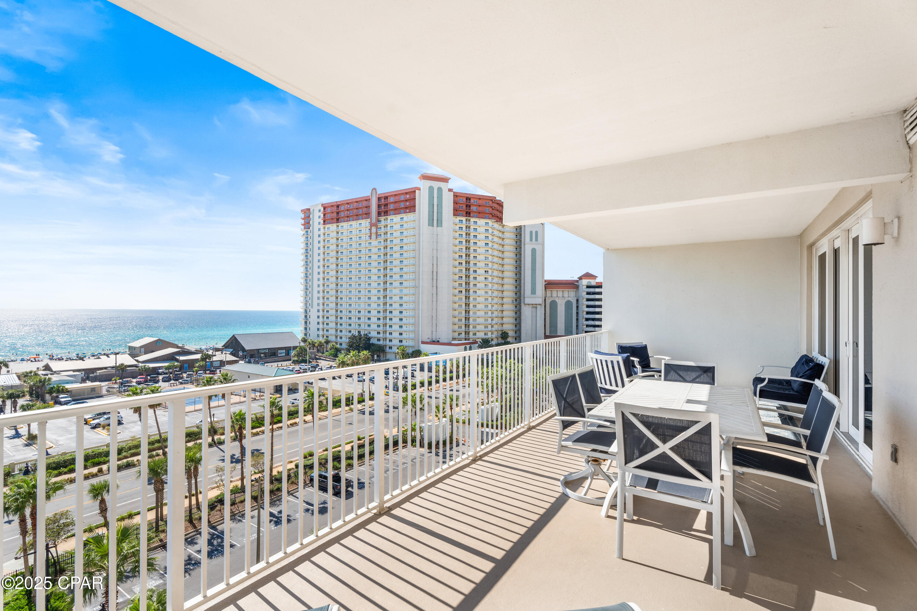 Gulf breezes in the morning, lagoon sunsets at night—life at Laketown Wharf invites that easy, every-day vacation feeling. Slide open the balcony doors and breathe in that coastal air as light fills the open living space, flowing into a flexible layout ideal for hosting friends or family. A bunk niche gives that extra sleeping option visitors always appreciate.

Out the door, the resort lives large: multiple pools, hot tubs, fitness center, a lakefront boardwalk with nightly fountain shows, and on-site dining and shops so you can grab a snack or sunscreen without leaving. The sugar-white beach lies just across the street, making sunrise strolls and afternoon splashes just steps away.

Close to Pineapple Willy's, local seafood spots, coffee shops, mini-golf, and the energy of Thomas Drive, this location roots you in everything visitors and locals love. With its guest-friendly layout, resort features, and beach access, this unit isn't just a place to stay—it's a turn-key piece of a vacation lifestyle, made to welcome guests again and again.
