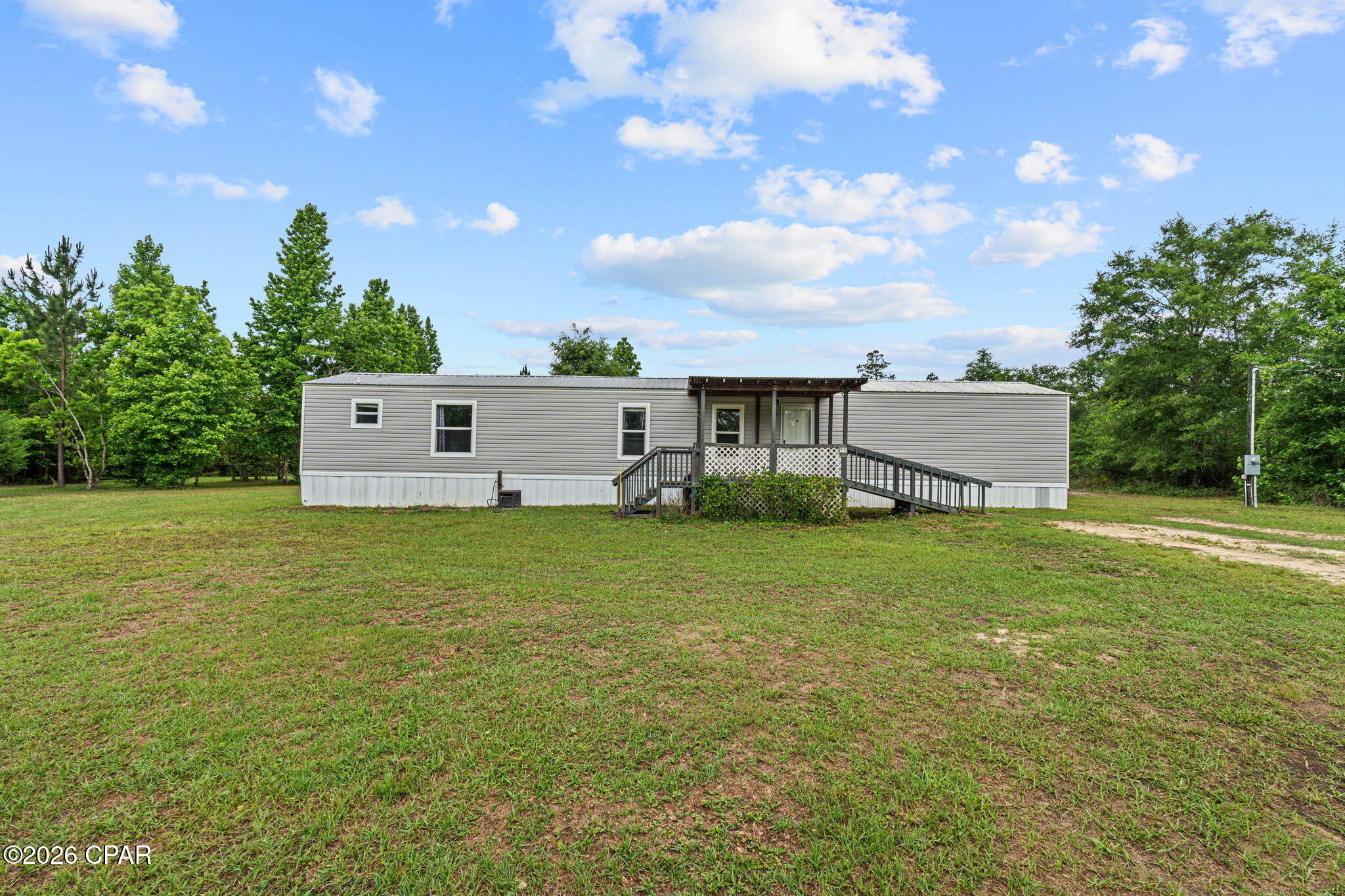 Must See! Over 17 Acres!
Two private ponds, a creek, and room to grow--this is the kind of property you don't come across twice.

This well-maintained 3-bedroom, 2-bath mobile home sits on a unique piece of land that blends privacy, natural beauty, and long-term potential, all while being conveniently located just off Highway 231 for easy access to town.

The property features two private ponds (one stocked with fish) and a natural creek running through, creating a peaceful, scenic setting that's perfect for relaxing, fishing, or simply enjoying the outdoors. With a mix of open space and mature trees, the land offers flexibility for a variety of uses--whether you're looking to spread out, garden, or plan for the future.

The home itself has been very well taken care of and includes a fenced backyard, ideal for pets. You'll also find a shed with electricity, perfect for a workshop or hobby space, along with a large connex container that provides substantial storage for equipment, tools, or business needs.

One of the most valuable features of this property is the oversized septic system, designed to support a larger home. This creates a rare opportunity for buyers considering building, expanding, or creating a multi-generational setup down the road (buyer to verify).

Whether you're looking for a primary residence, a private retreat, or a property with future potential, this one offers a combination of function, flexibility, and natural beauty that's hard to find.