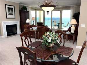 Absolutely fabulous * Grande Surf Club is a luxury building with incredible views of the Gulf coastline to the east and west * The serenity of this building is assured by only 2 units per floor * Imagine 2100 SF with 3 large Bedrooms and 3 full Baths * The very spacious kitchen has wood cabinets with corian counter tops, drop in glass stove, deep sinks, microwave, side by side refrigerator, large pantry, 2X2 custom tile floor and a large window overlooking the east end of the beaches * Great room with million dollar views. plush carpeting, gas fireplace and a incredible wrap-around balcony view, glass doors open to the 36' X 10' balcony * The master suite is luxurious with another fabulous view, sliding doors to balcony and walk in closet * Master bath has large whirlpool tub,