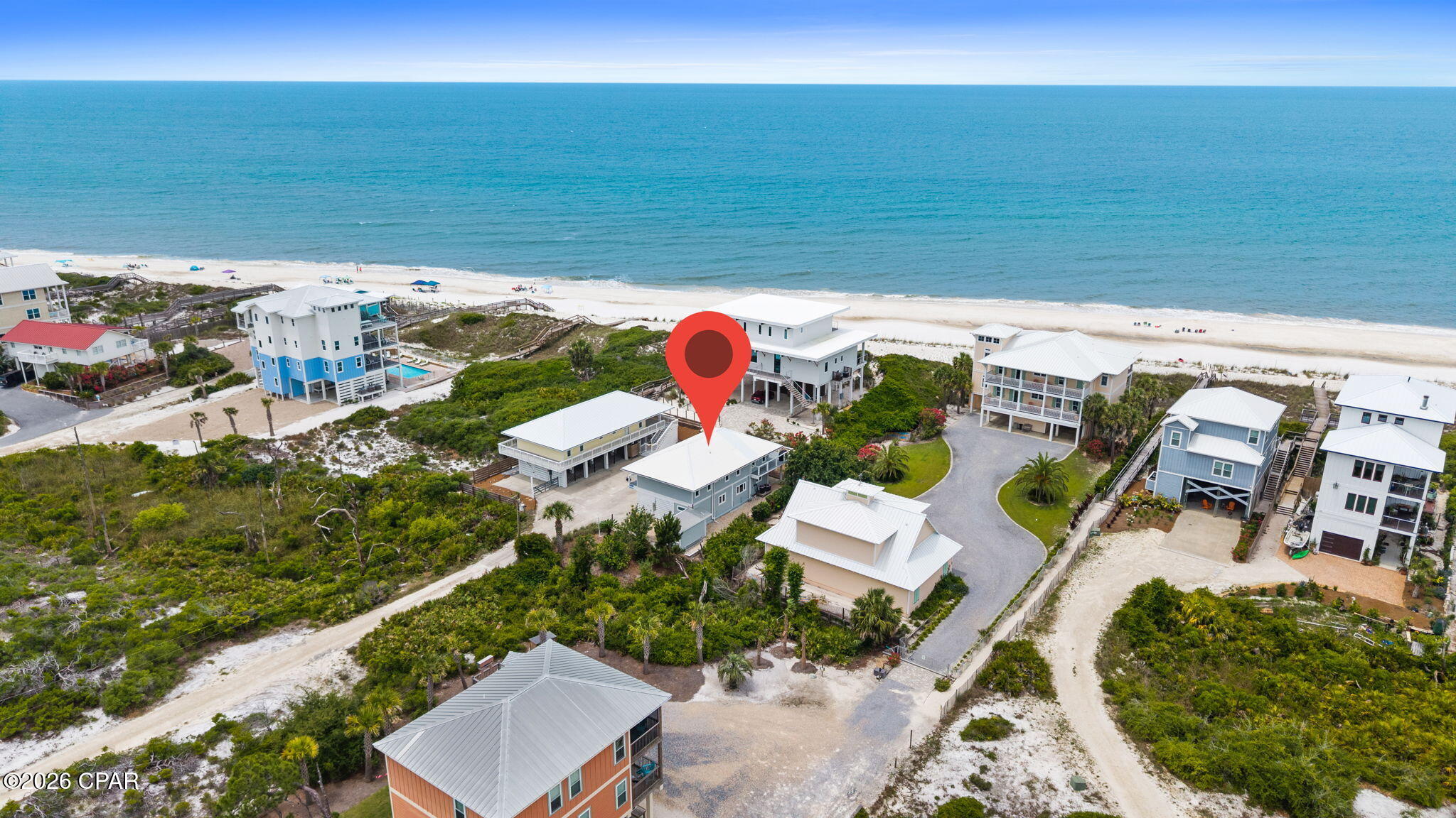 PRIVATE PARADISE FOUND!! Steps to the sand from 179 Spoonbill Ln, a beautifully renovated 4BR/3BA beach retreat tucked away on a private drive in the highly sought-after North Cape San Blas area. Positioned on a coveted front loaded first-tier homesite, this exceptional property blends coastal charm with extensive interior & exterior upgrades designed for style, comfort & durability. Inside, you'll find all-new luxury vinyl plank flooring, custom shiplap accents, upgraded trim work, new doors & hardware, beautifully finished window casings, updated window treatments & a stunning fireplace feature highlighted by a floating cypress wood mantel. The refreshed kitchen showcases a stylish new backsplash, upgraded finishes & custom refaced shaker cabinetry, creating the perfect gathering space for family & friends. Both upstairs bathrooms have been thoughtfully redesigned with elegant walk-in glass showers, designer tile, matching Delta fixtures & contemporary lighting. Adding tremendous value & flexibility is an approximately 800-square-foot self-sustaining lower-level living area ideal for guests, multi-generational living, a private owner's retreat or additional rental income. This beautifully renovated space includes new countertops, backsplash & a spa-inspired bath featuring a double vanity, soaking tub & walk-in glass shower.  Exterior improvements include new Hardie siding, architectural enhancements, updated lighting & a spacious Trex composite deck with new marine grade stainless steel cable railing perfect for entertaining or relaxing in the coastal breeze. Whether you're seeking a primary residence, vacation getaway or income-producing investment, this property offers outstanding versatility in one of Cape San Blas' most desirable locations. Enjoy easy access to St. Joseph Peninsula State Park, world-class fishing, boating, kayaking, scenic bike paths, local restaurants, boutique shopping & all the charm of nearby Port St. Joe. Opportunities like this are increasingly rare on the Cape. Call for your private tour & LIVE THE BEACH LIFE!
