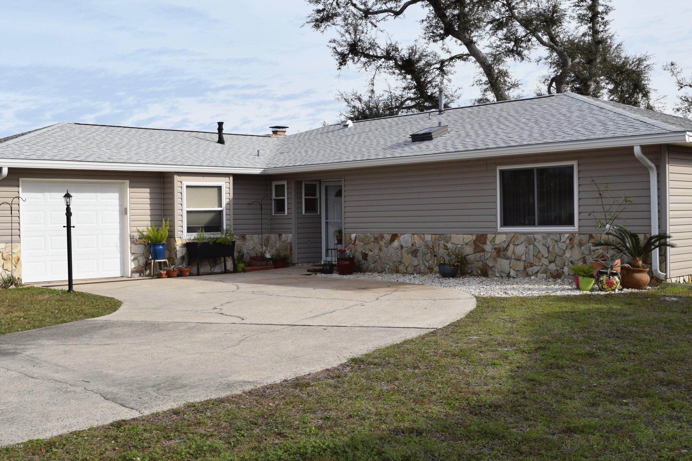 This home was completely renovated in 2010 and sustained little damage from Hurricane Michael.  Kitchen features Custom Solid maple cabinetry with soft close drawers. Granite Counters and Sink. Range is gas with a griddle and 2 convection ovens and pot filler.  Touchless faucet, dishwasher,  side by side fridge and over the range micro hood. and a breakfast bar. Bar and pantry in dining area. Remote control gas fireplace in the living room with a patio door leading to the large privacy fenced back yard. His and her closets in master bed. Office with granite and cabinets, inside laundry. Transferrable warranty on Roof. Transferrable Lifetime warranty on your Low E  windows.  There are hurricane screens, a tankless water heater and a storage building just to name a few of the extras.  There is a detailed list in the document section