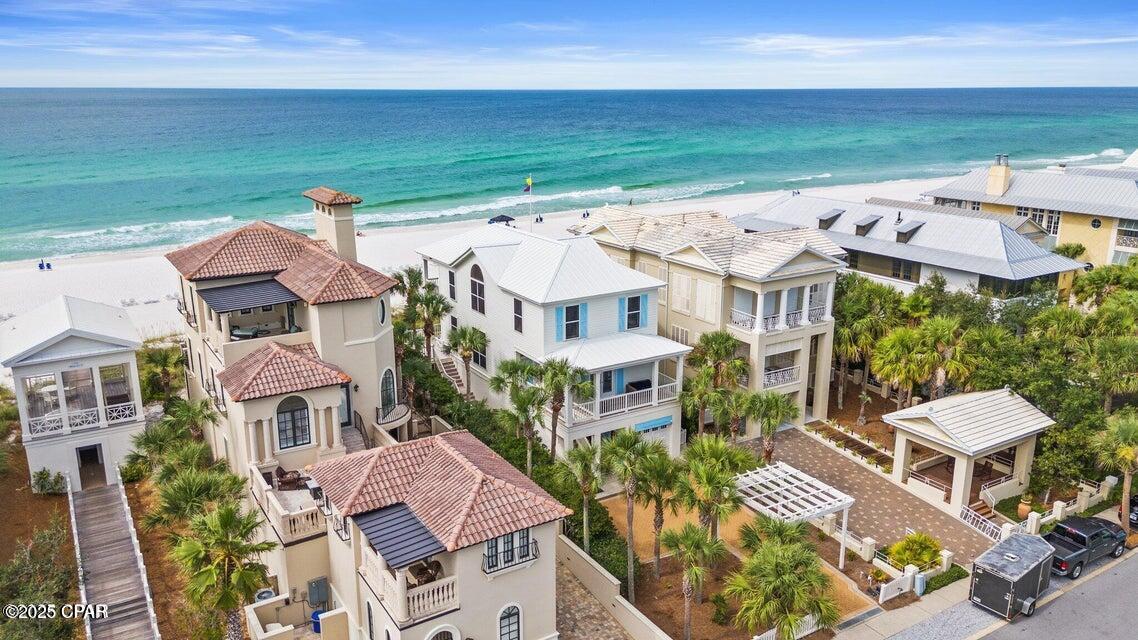 Stunning Gulf Front Single-Family Home in Carillon Beach. Just three miles from Rosemary Beach, this dream home offers the perfect blend of luxury, comfort, and breathtaking views. With 5 spacious bedrooms, 4.5 baths, and a host of premium features, this gulf front property is a true gem. Key Features: - Master Suite: Located on the third floor, the master suite features expansive gulf views, dynamic vaulted ceiling, and a large private porch, perfect for enjoying serene sunsets and the sound of the waves. - Second Master Suite: The 2nd bedroom, located on the main floor (second floor), serves as a second master suite, offering extra space and privacy for guests or family members, and its' own private balcony.

- Additional Bedrooms: The 3rd floor includes two more bedroomsa whimsical bunk room with a loft built like a ship, perfect for children or adventurous guests, and a spacious queen bedroom for comfort and relaxation.
- Living and Dining Area: The main floor features a spacious kitchen, living and dining open floor plan with stunning gulf viewsperfect for entertaining and walking out onto the huge gulf front porch.
- Extra Den: The ground floor offers an additional den, ideal for a home office or media room.
- Laundry: This home offers two convenient laundry areasone on the top floor and another on the ground floor, providing added convenience for families or guests.
- New Appliances: The home is equipped with all-new, high-end appliances, including a Sub-Zero refrigerator, a Bosch dishwasher and a Café 30 convection range ensuring both style and functionality in the kitchen.
- Garage: The ground floor includes a 1-car garage for added storage and parking.
- Room for Expansion: The property also has ample space to build a guest house with a garage, offering even more flexibility for family, guests, or rental opportunities.
- Impeccable Condition: The current owner has meticulously maintained the property, ensuring it is move-in ready!
Community Amenities:
- Highest Gulf Front Elevation: Enjoy one of the highest gulf front elevations in Carillon Beach, offering unparalleled views and peace of mind.
- Gated Community: Feel secure with 24/7 access to this exclusive, gated neighborhood.
- Pools: The community features three pools, including one beachfront pool, perfect for relaxing or enjoying a swim.
- Private Beach: Stroll along the 1-mile-long private beach, renowned for its powder- white sand and crystal-clear ''Windex blue'' waters.
- Sports & Recreation: Take advantage of the community's pickleball courts, tennis courts, basketball court, and playground.
- Restaurants and Shopping: Carillon has restaurants, shopping and a downtown area offering live music, great food and a community open space located on Lake Carillon perfect for spending time with neighbors and friends.
- Prime Location: Located just three miles from Rosemary Beach and right next to scenic 30A, you are near all the action but can still enjoy a quiet, private expansive beach.
Do not miss the opportunity to own this stunning gulf front home. Contact me today to schedule a viewing and make this paradise your own!
