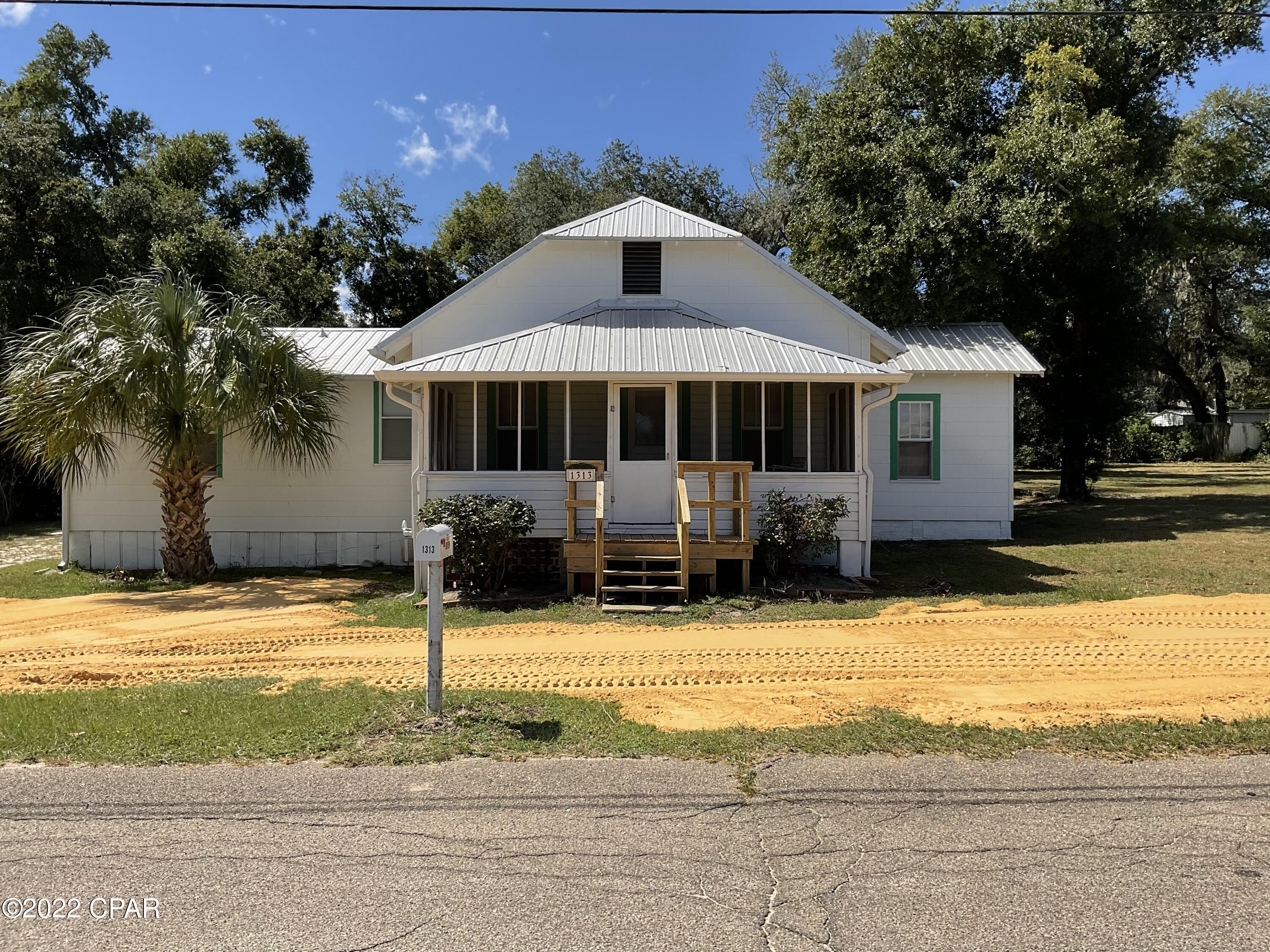 Come check out this 4 bedroom home in historic St. Andrews.   The home is located within walking distance to the bay and to the center of St. Andrews where you can participate in all the parades, farmers market, antique shops and some of the best restaurants in Panama City.    There is a wonderful screened porch across the front of the home.  The home does have a new metal roof after Hurricane Michael.   The home is move in ready but it could use some updating and and the location just can't be beat.