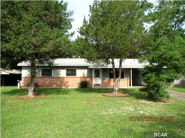 GREAT HOUSE AT AN AFFORDABLE PRICE! This home features ceramic tile throughout the living room, kitchen and additional den that was added to the back of the home. The updated kitchen has light oak cabinets with an attractive tile backsplash, and the full bath has also had tile updates. Situated on a large lot, the home as a covered patio and a carport. Home being sold in its AS IS condition.