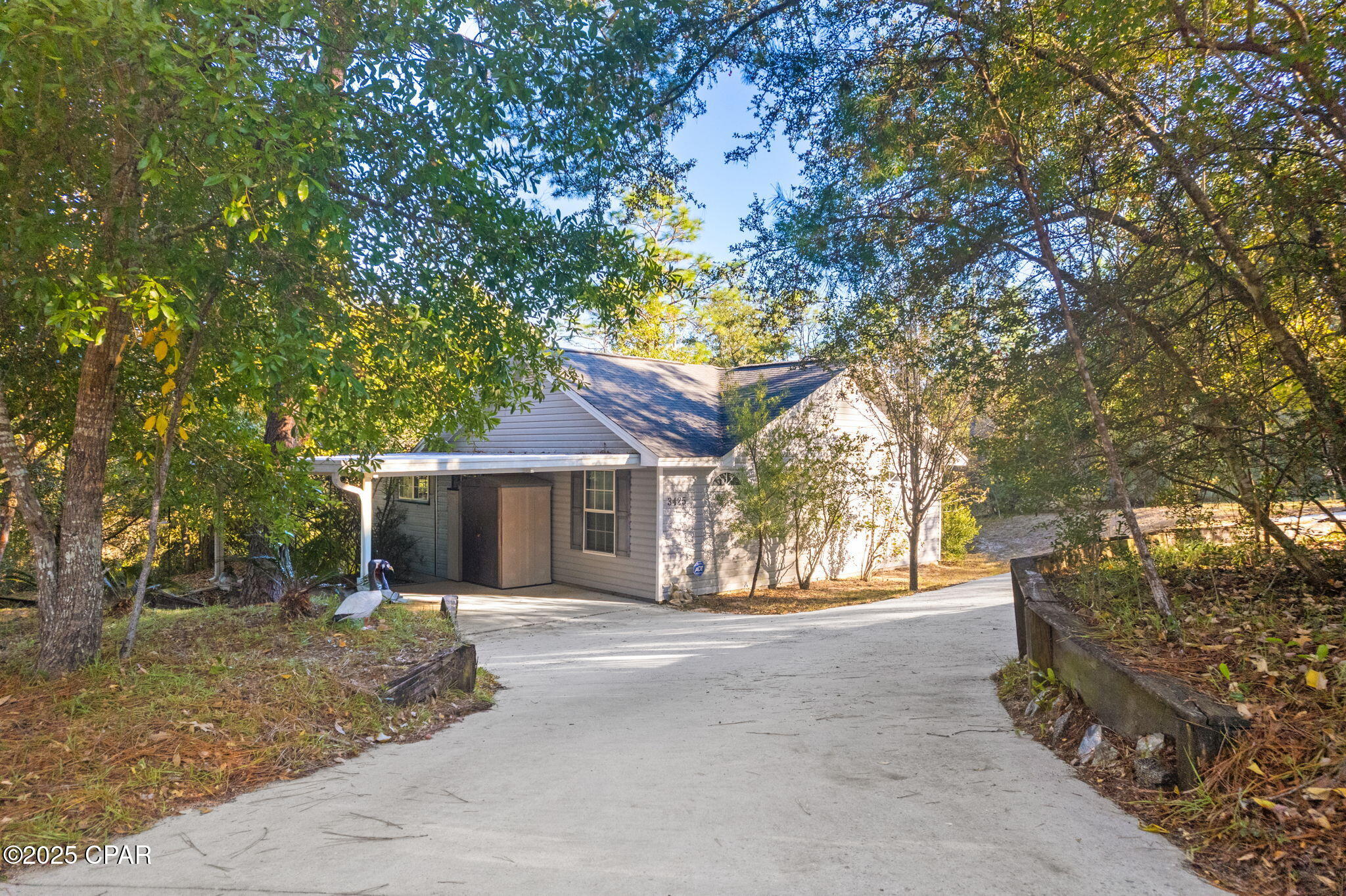 Welcome to your lakefront retreat! This 3BR/2BA home sits on a beautifully wooded 1.01-acre lot and offers direct access for swimming, fishing, and non-motorized boating. The interior features LVP flooring, Corian kitchen countertops, and a fully equipped kitchen. Enjoy the screen-enclosed sunroom, perfect for morning coffee or watching sunsets over the lake. Major upgrades include a newer HVAC (2023), new window screens (2025), and a newer well pump (2022). Located in a secure, gated community with top-notch amenities to include pool, tennis, walking trails, playground, basketball court, and boat launch...yet just a short drive to Panama City. You do not want to miss this opportunity. Schedule your private showing today!