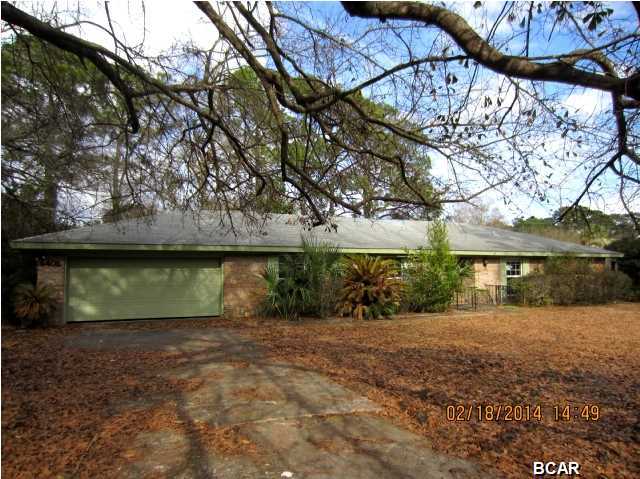 NORTH SHORE HOME WITH LOADS OF POSSIBILITIES! This four bedroom, all brick home is situated on a spacious, tree-filled lot. The home features a large formal living/dining room combination, full kitchen with eat-in breakfast area, and a Family room with a wood-burning fireplace and built-in book shelves. The bedrooms are all a generous size. A little paint and flooring would make this house shine! The home has a two-car attached garage and outside workshop. This home is being sold in its AS IS Condition.