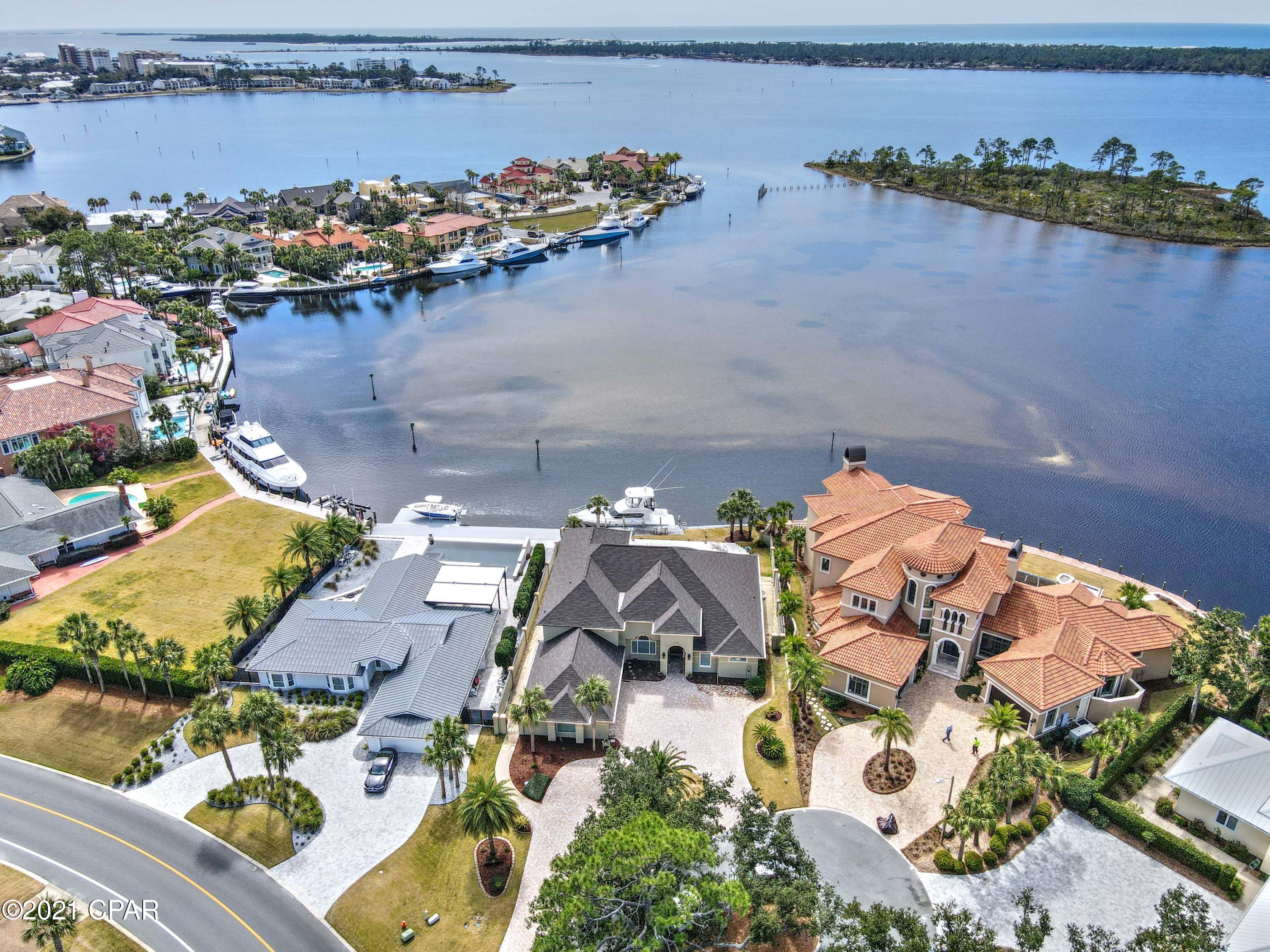 CURRENTLY UNDER CONTRACT, SELLER ACCEPTING BACKUP OFFERS. Waterfront home in Bay Point, east of the bridge and 90 feet on DEEP WATER - perfect for your yacht & water toys! Relax and take in gorgeous Grand Lagoon views from your spacious covered patio, pool, and hot tub.  Featuring 4 bedrooms and 4 baths, enjoy the perfect floor plan with almost all rooms on the main level, including the master bedroom and office. Open kitchen, butler's pantry, tall ceilings,  ample storage, and a view from every room!  Great curb appeal, 3 car garage, new roof, 3 HVAC systems , new hot water heater, a second instant gas hot water heater for the master, pool just resurfaced, updated kitchen and brand new master bath.  Call today - this literally checks all the boxes of waterfront simple elegance.
