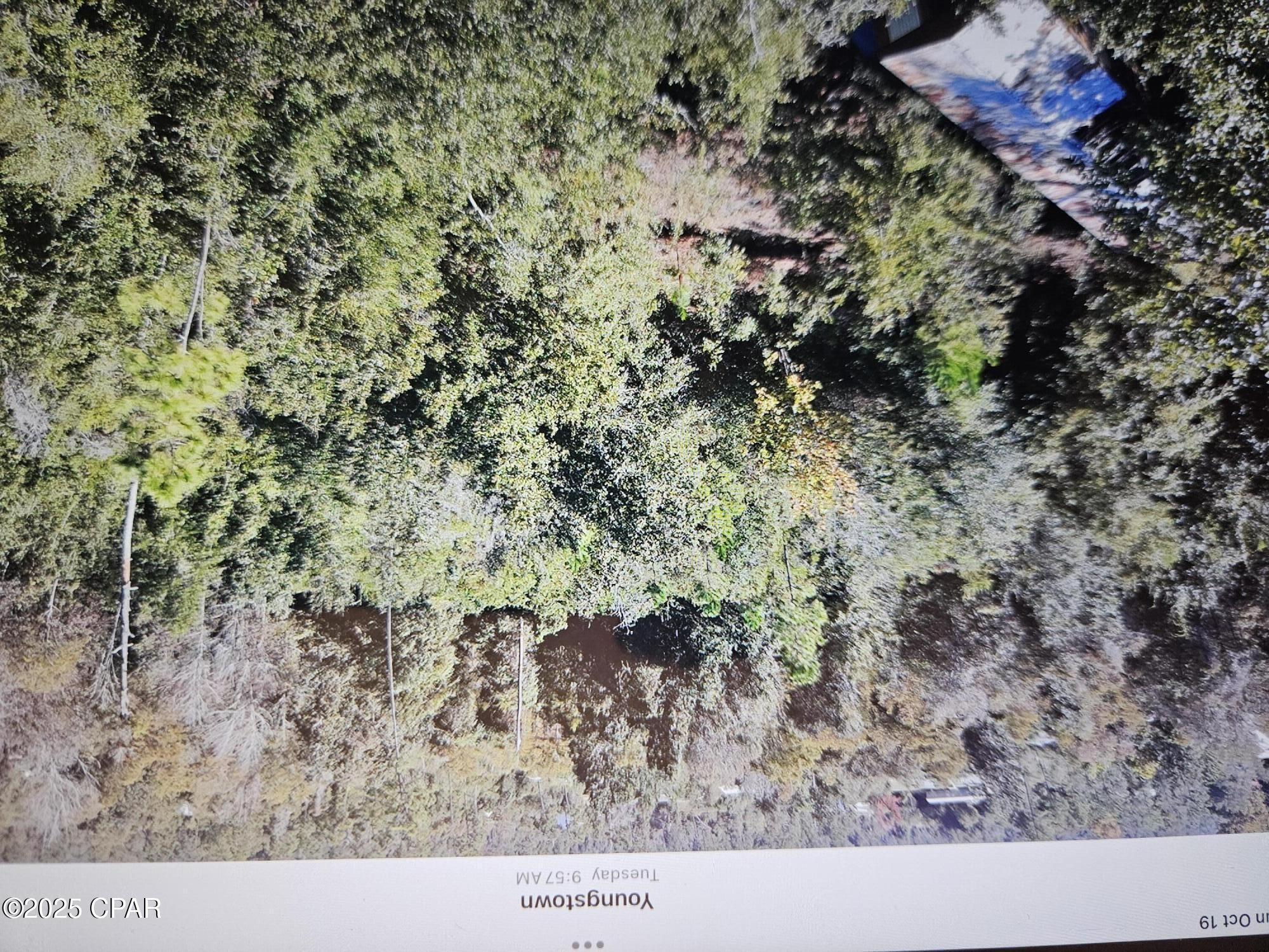 Large 1.4 acre lot, mostly wooded with some clearing, there is a mobile home on the property. buyer to determine the value.