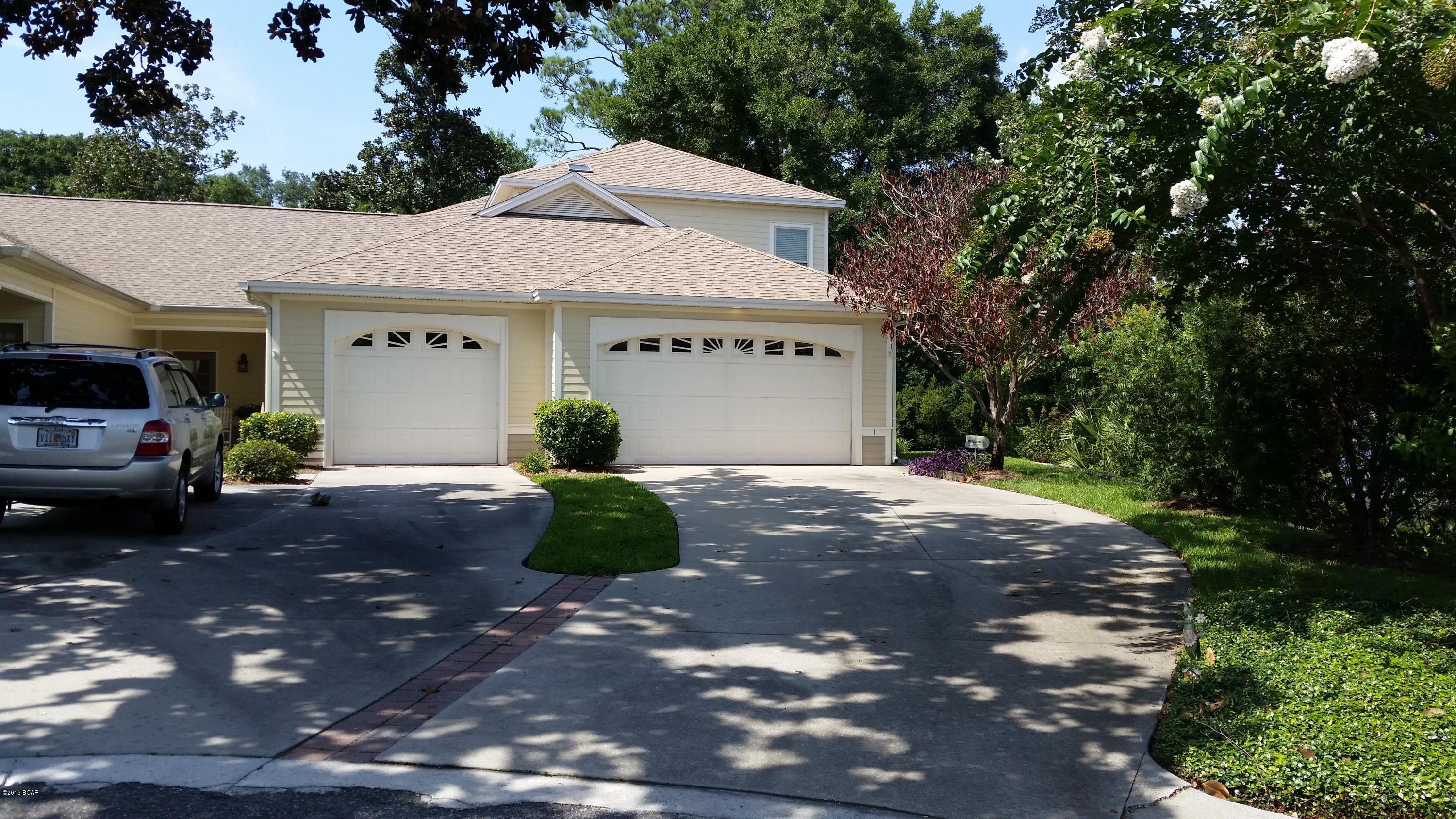 GREAT REDUCTION! Lovely town home end unit with panoramic view of Hentz Lake and all its natural beauty! Privacy on your large screened porch under beautiful Oak trees and  manicured yards without your lifting a finger.  One owner unit, and upgrades were made prior to purchase during construction. Master bedroom suite is on main floor with sitting area or office, tile shower, Jaccuzzi tub, and double vanities.  The two additional bedrooms,  spacious loft area & full bath are upstairs. Chair lift conveys, if wanted. Large kitchen with beautiful cabinetry, solid surface counters, Jenn-Aire down draft  solid surface cook top/oven, Refrigerator with ice/maker.   A spacious great room with trey ceiling opens on to dining room, breakfast bar and kitchen, all of which view the beautiful Lake Hent