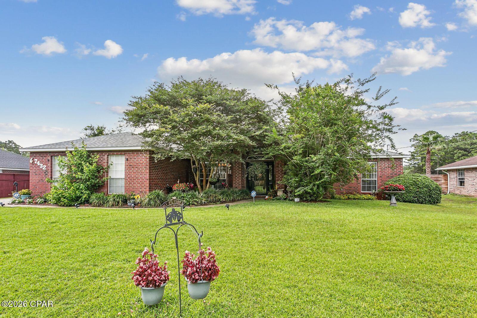 Location! Location! Location! Beautiful All Brick home sitting on one of the largest lots (3/4 acres), and in the highly desirable Holley by the Sea Community, thus offering resort style amenities.  This 4-bedroom 2 bath beauty incorporates an elegant entrance with a large foyer and major upgrades with polished porcelain floors throughout (no carpet), new interior paint and baseboards, patio French doors and kitchen counter tops. The spacious living room with wood burning fireplace and vaulted ceiling gives you all the comfort you need for relaxation.  The formal dining room incorporates raised ceilings and arched accent windows. A large kitchen with an island/breakfast bar, ample cabinetry and pantry.  An  informal dining area with bay windows overlooking the back yard incorporates casual dinning in the kitchen.  Large master bedroom with trey ceilings.  The master bath has double vanities, large walk in closest, whirlpool tub and separate shower.  All bathrooms equipped with LED crystal lights.  The split bedroom floor plan allows you additional privacy.  The back yard patio is fully screened in with views of the large manicured yard and plenty of room to put an inground pool.  This back yard and lot at almost 3/4 of an acre gives your children plenty of room to play and fully fenced in to include a sprinkler system on a new well pump.  Holley by the Sea is a paradise for the residents residing at the plus 40,000 acres of fun fun fun.  At a low annual HOA fee of $595....this is what you get; BBQ Pit Grill, beach, boat launch, fishing dock, community room, exercise room, baseball/softball fields, tennis and pickle ball courts, outdoor and indoor pools,  picnic and playground area, sauna, steam-room and much more.  No community in the area offers all of these amenities, to include the Hidden Creek Golf Course if you are an avid golfer.   You are also close to Highway 98, Hurlburt A.F.B. and minutes from the white sandy beaches of the Gulf.  Price to sell and wont last long.