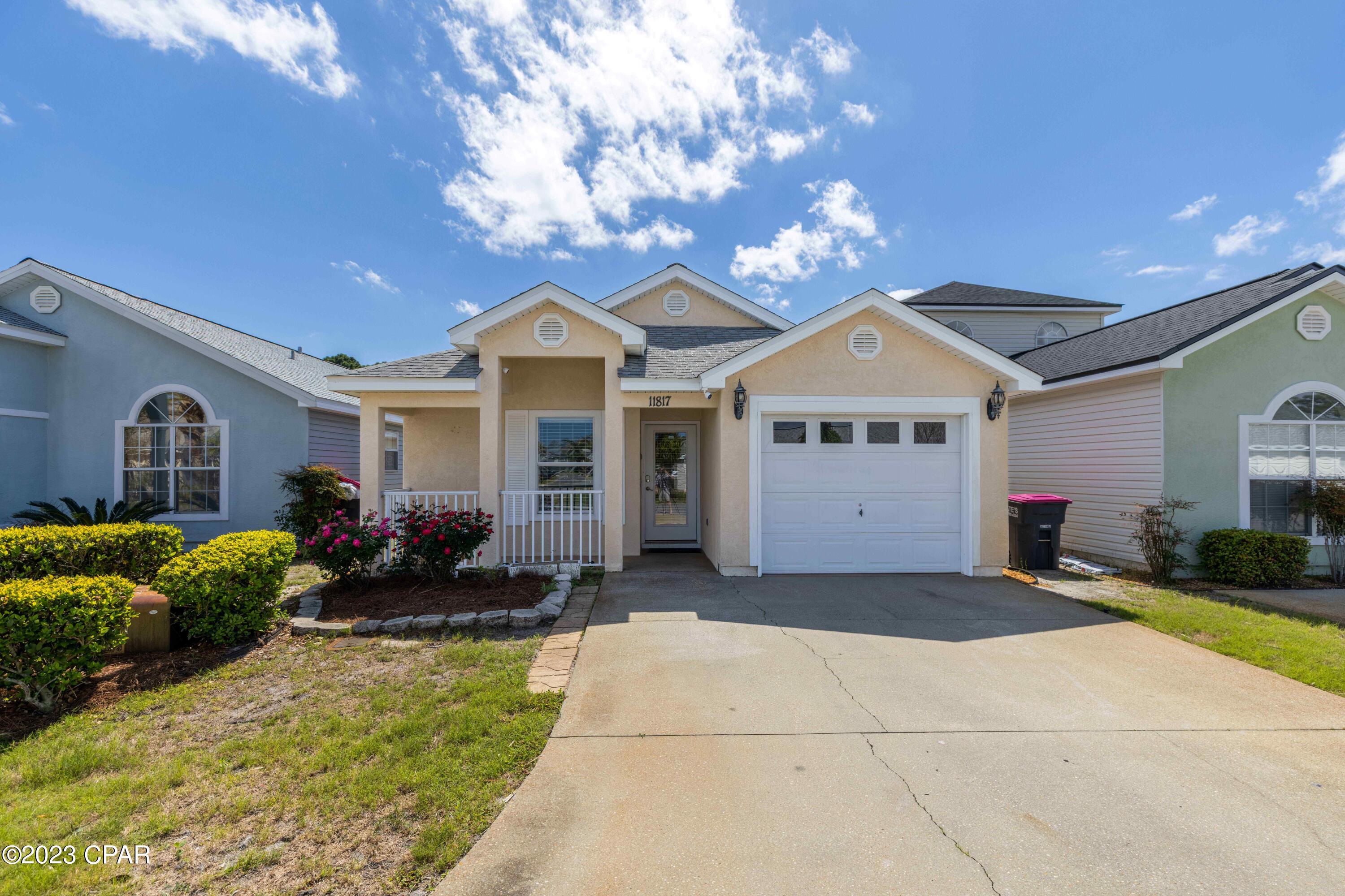 Located approximately 1.2 miles from Panama City Beach beach access 38, this turnkey, FURNISHED and updated house is ready to be added to your investment portfolio whether as a SHORT TERM RENTAL property, primary residence or a second home.  Rental history from AirBnb and projections are available.  The house is backed up to the 2 community pools.  Hang out in the screened in porch area while having a bbq and enjoying a swim.  Warmer weather is here!  This 3 bedrooms and 2 bath home is tastefully decorated with beach decor, wood like floor tile throughout and stainless steel appliances.  The front bedroom offers a queen sized bed with the middle bedroom having a double/twin bunk and a full/twin bunk.  The master bedroom has a queen sized bed.  The HVAC has been recently serviced, water heater installed 2023, and the roof is 7 years old.