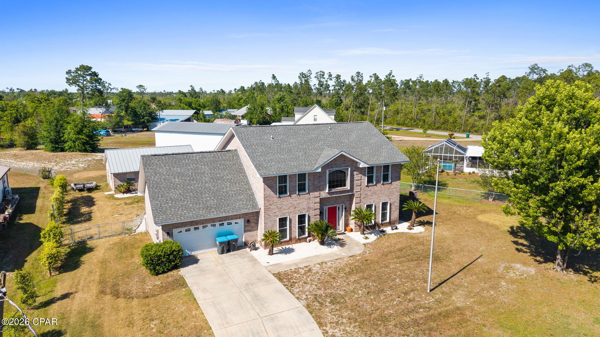 This custom-built, all-brick two-story home offering over 2,800 square feet of living space, featuring 4 bedrooms, 3 bathrooms, and situated on more than three-quarters of an acre.

As you step inside, you're greeted by soaring 20-foot ceilings that create an impressive sense of space and natural light throughout the main living areas. The updated kitchen is designed for both style and function, featuring granite countertops, stainless steel appliances, and an open layout that flows seamlessly into the great room and breakfast nook, making it perfect for everyday living and entertaining.

The home also offers a separate living room with a cozy fireplace, providing a warm and inviting space to relax. The primary suite serves as a private retreat and includes a beautifully updated bathroom, while updated flooring throughout the home adds a modern touch.

Outside, the property continues to impress with a large shop with electricity and a detached garage, offering plenty of space for hobbies, storage, or a workshop.

With its spacious layout, quality construction, and expansive lot, this home offers the perfect combination of comfort, functionality, and room to grow.