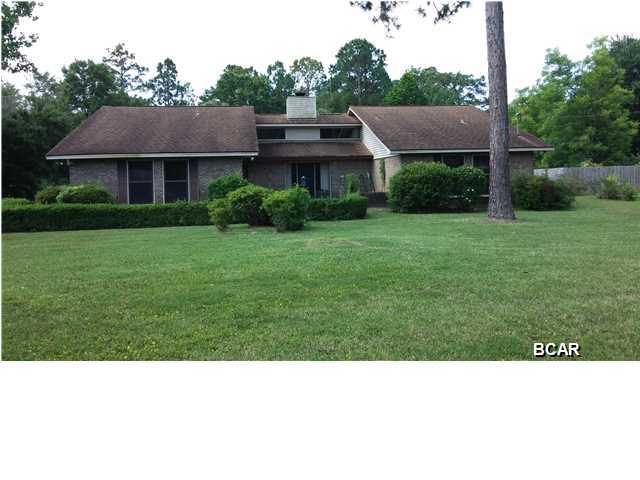 This is a must SEE. Large(2314 sq.. ft.)3 bedroom 2 and 1/2 bath home, situated on a .771 acre corner lot. Exterior features include: Professionally landscaped yard, with large mature trees, which include citrus, palms, fig, oaks, Creep Myrtle and beautiful hedges. Irrigation system. In-ground pool with privacy fenced oasis retreat. Separate water meter for filling pool. 20 x 10 storage shed. All brick exterior, with maintenance free vinyl soffits. Interior features include large eat in kitchen with family room. Large Great Room, with large brick wood burning fire place, cedar ceilings, and cedar accents on the walls. All bedrooms are larger than average, with ample closet space in each room. All appliances convey, including washer and dryer. This home needs very little TLC, and is