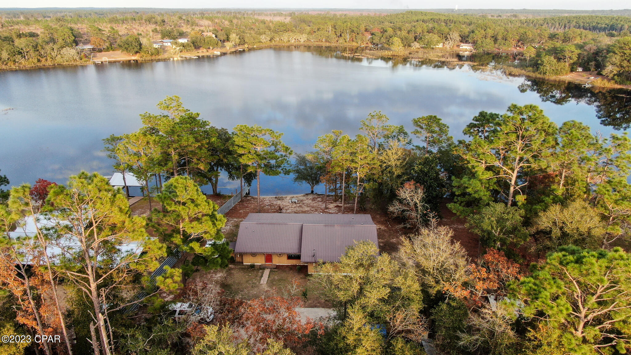 CURRENTLY UNDER CONTRACT, SELLER WILL CONSIDER BACKUP OFFERS,

Seller is offering $5,000 in closing cost assistance. Who said they needed a Lake House? Well, this beautiful 4-bedroom, 3-bathroom lakefront home is situated on a spacious .83-acre lot and offers a breathtaking view of Chain Lake. The 50' screened-in back patio provides the perfect space for you and your family to relax and enjoy the tranquil surroundings.



As you step inside, you'll be greeted by the home's open floor plan, which allows for natural light to flood the space through the 3 sliding glass doors that face the Lake. The kitchen is equipped with stainless steel appliances and a large breakfast bar that offers ample counter space for all your cooking needs.



The Master Suite is a true retreat, featuring its own pr The Master Suite is a true retreat, featuring its own private exit to the back porch where you can unwind and enjoy the

 steal furnace on cool nights. The property also includes a single car garage that could be used as a workshop.

Chain Lake is an outdoorsman paradise, offering great fishing and tubing opportunities. Don't miss out on the chance to make this Lake Front Dream Home your very own!