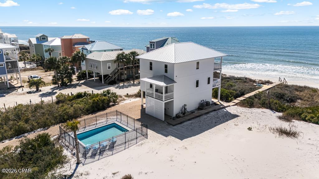 Under Contract - taking back ups! GULF FRONT, X FLOOD ZONE BRAND NEW CONSTRUCTION. This newly built home comfortably sleeps up to 14 and is thoughtfully designed for both relaxation and rental income. The layout includes four bedrooms plus a versatile ground-floor bonus space that functions as a bunk room, rec room, or fifth bedroom. Custom built-in kids' bunks are featured on the top floor, making it ideal for larger groups. Approximately 800 square feet of outdoor living space spans multiple decks, complemented by a private pool with paver decking, perfect for sunbathing and entertaining. A private walkover provides direct access to the beach, delivering true Gulf-front living. Step right onto the Loggerhead Trails bike path for an easy, scenic walk or bike ride to Scallop Cove, offering one-stop shopping and coastal conveniences. You can also bike directly into St. Joe Peninsula State Park, home to the beach named #1 Beach in America, where miles of pristine shoreline, nature trails, and outdoor adventure await. Conveniently located near the Eagle Harbor boat ramp within the state park and just a short drive to shopping and dining in Port St. Joe and Apalachicola, this location offers the best of coastal living. Schedule your private tour today!
