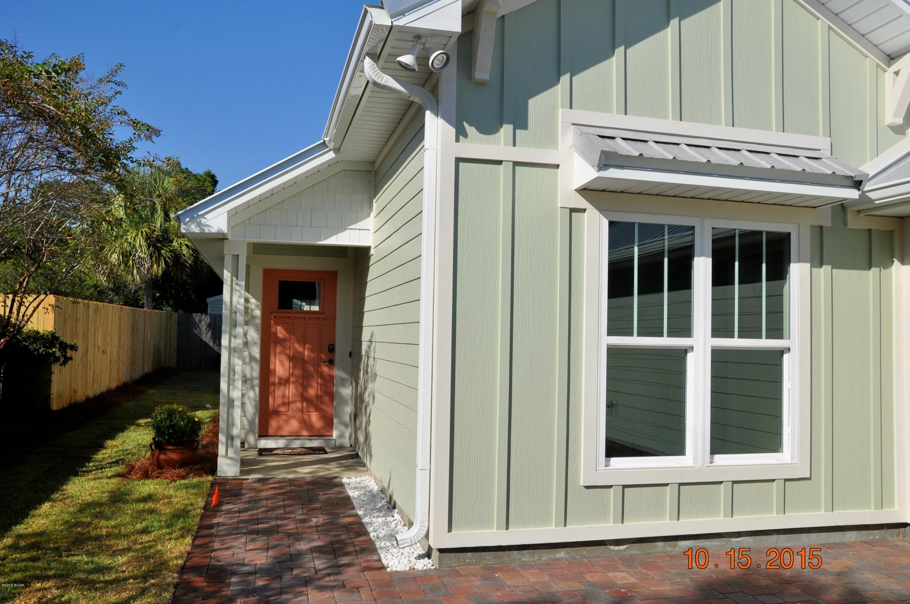 ***  WOW Factor Alert!  ***

	This gorgeous Coastal Craftsman style home combines all the modern amenities with many nice upgrades you'll typically see only in high end custom homes. This home is designed and built by the beach's leading custom home builder, Koehnemann + Gibbs.  Their standard of quality, craftsmanship and value-engineering are ingrained throughout. 

	Every designer touch has been incorporated into this home; offering light colors, upgraded coastal cabinetry with soft-close hardware, three-part crown moldings, accent painted interior doors, and rich fixtures.  This home is warm and inviting and feels much bigger than its 1436 square feet because of the thoughtfully designed open floor plan, with high ceilings and lots of natural light. Fully Landscaped Yard. A broad paver stone-accented driveway welcomes your guests, and leads to a paver sidewalk and front rocking porch.  There's a fully landscaped and sodded yard with full coverage irrigation system. Inside you'll find weathered wood-look ceramic tile floors to enhance the casual coastal feel of Old Florida. The well-planned kitchen is highlighted by gorgeous granite counter-top, with coordinating tile back splash and Whirlpool EnergyStar stainless steel appliances.  Double Master Bath vanities and mocha cabinetry finish the bathrooms.
	Some of the premium Energy-Efficiency features include Solar-Shield roof decking, reflective metal roof, Icynene spray foam insulation, Low-E window and door glass, a 15 SEER Trane heat pump, and a General Electric heat pump water heater! 
	The hurricane resistance system includes Tie-Max all-thread rods, impact-resistant windows, and screw-down metal roofing with self-adhesive underlayment.
	And don't forget the two huge storage attics!!  One over the garage, and one conditioned attic over the living area for seasonal or long term items!  Storage galore!  And so much more!!