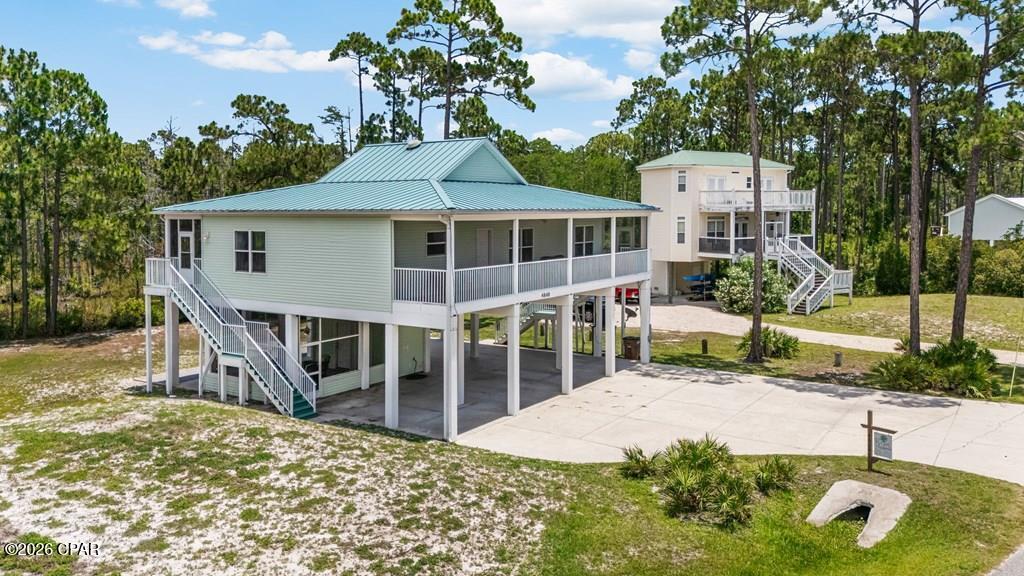 RENOVATED IN 2024 | BAY VIEWS | COZY COASTAL RETREAT If you've been looking for a place that feels peaceful, private, and truly connected to nature, this is it. This lovely updated 3-bedroom, 2-bath home sits between Cape San Blas and Simmons Bayou, offering Bay views and a setting that's hard to find. One of the things you'll love most about this property is the privacy. With a buffer preserve behind the home and open space across the highway, there are no close neighbors crowding your views. Instead, you'll enjoy beautiful sunrises and the natural beauty that makes the Forgotten Coast so special. Inside, the home is warm, inviting, and full of charm. It offers a bright, open layout that feels both comfortable and functional. Whether you're enjoying your morning coffee, gathering with family after a day on the water, or simply relaxing at home, the living spaces feel cozy and welcoming. Outside, the property is set up for the coastal lifestyle. Enjoy two spacious decks that span the entire length of the home. One in the front and one in the back, providing plenty of room to relax, entertain, and take in the surrounding scenery. There's an outdoor shower for rinsing off after the beach, and a 15-foot clearance parking pad with plenty of room for a boat or RV. The location couldn't be better. You're just minutes from public beaches, bay access, boat launches, parks, and some of the area's best fishing and outdoor recreation. Salinas Park is nearby and offers beach access, pickleball and volleyball courts, playgrounds, and walking paths along the coast. Whether you're searching for a full-time home, a vacation getaway, or an investment property, this home captures everything people love about Cape San Blas. Beautiful views, easy water access, and a relaxed coastal atmosphere where life moves at a slower pace. Come see for yourself why this special property feels so much like home.