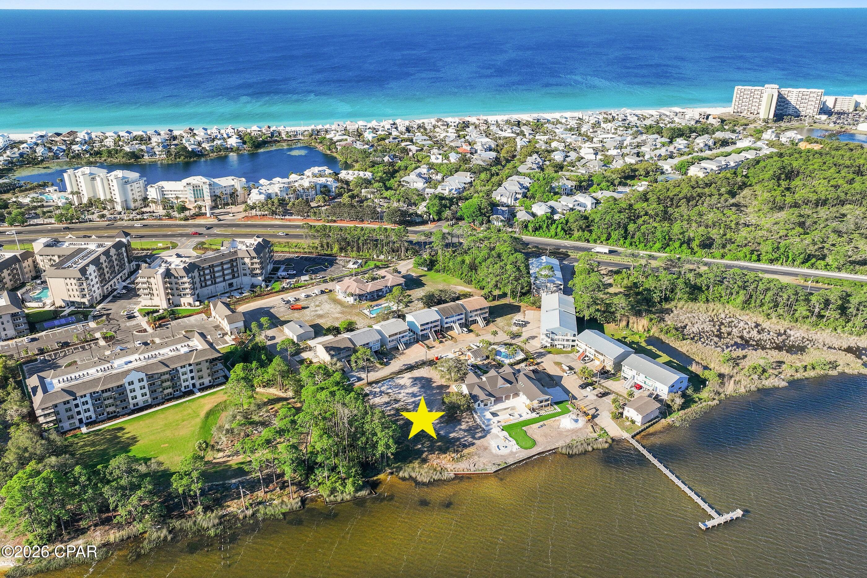 Build your dream home on this exceptional .74-acre waterfront homesite on Lake Powell--Florida's largest coastal dune lake. Rarely do opportunities like this come available, offering both generous depth and expansive frontage along the main body of the lake. With no restrictions on vacation rentals, this property presents incredible flexibility--whether you envision a private coastal retreat or a high-performing investment property. The size and setting allow for the creation of a true destination-style residence, with ample room for outdoor living, a private pool, private dock and boat lift, providing seamless access to Lake Powell and the Gulf and beaches. Ideally positioned in West Panama City Beach, you're less than a mile to the nearest beach access and just moments from the dining, shopping, and charm of Scenic Highway 30A, as well as the natural beauty of Camp Helen State Park. Just beyond the inlet, the Gulf waters offer access to nearby artificial reefs and productive fishing grounds--adding to the exceptional waterfront lifestyle this location provides. An exceptional opportunity to build, invest, and enjoy one of the area's most sought-after waterfront settings.