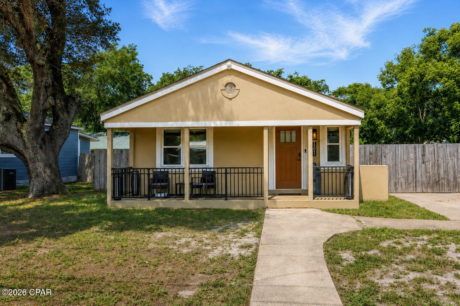 Rare opportunity in St. Andrews! This fully remodeled three-bedroom, two-bath home is being sold with a separate waterfront parcel on Lake Huntington, located approximately 300 feet from the residence. The list price includes both properties, and they must be sold together.

The home features luxury vinyl plank flooring, recessed lighting, updated fixtures, and an easy flow between the living room, kitchen, and dining area. The remodeled kitchen offers white shaker-style cabinetry, solid-surface countertops, stainless steel appliances, a gas range, and an adjoining coffee or beverage station. The oversized primary suite includes a private bath and a large closet with a built-in organization system. Additional features include two guest bedrooms, an updated guest bath, a spacious laundry room with a folding counter and storage, updated windows, modern ceiling fans, and a tankless water heater.

Outside, the large fenced lot provides a gated driveway, abundant parking for a boat or trailer, patio space, and an above-ground pool. The separate 0.064-acre waterfront parcel measures approximately 50 by 75 feet and offers roughly 50 feet of frontage on Lake Huntington. The waterway provides access toward St. Andrews Bay and creates a private setting for fishing, kayaking, watching the sunset, or potentially adding a dock or boat lift. No dock or boat lift is currently installed. Buyers should verify water depth, navigability, boundaries, and permitting requirements for their intended use.

Short-term rental use is permitted at the residence, subject to obtaining all required licenses, registrations, and approvals. The home is also within walking distance of Historic St. Andrews, locally owned restaurants, waterfront parks, shopping, entertainment, and the St. Andrews Marina. This property offers a rare combination of a remodeled home, short-term rental potential, boat parking, a walkable St. Andrews location, and nearby privately owned waterfront. All measurements and information should be verified by the buyer if important.