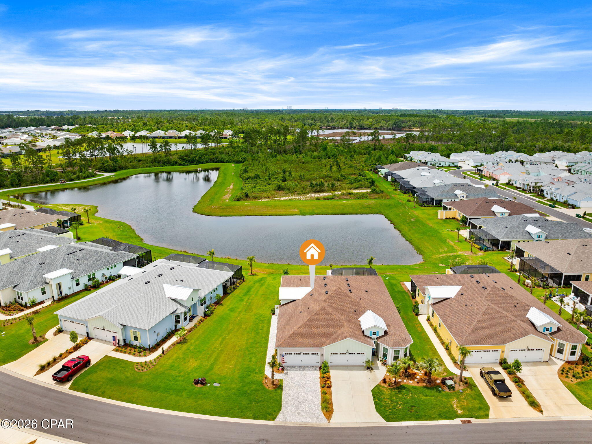 Rare opportunity to own an Antigua Villa on one of the most desirable homesites in Latitude Margaritaville Watersound! Perfectly positioned on an oversized lot with both pond and preserve views, this exceptional property offers the rarest combination of privacy, nature, and water views. Located on a quiet cul-de-sac street in highly sought-after Phase 6BC, you'll enjoy breathtaking sunrises, colorful sunsets, and abundant wildlife right from your backyard.

This beautifully maintained villa features numerous upgrades, including wood-look tile flooring throughout in a light coastal color, designer lighting and ceiling fans added after closing, custom interior paint, upgraded cabinetry, granite countertops, a 40/60 sink, and an upgraded electric induction range with Air Fry capability. The open-concept design creates an inviting space for everyday living and entertaining.

The spacious primary suite offers a luxurious bath with a tiled walk-in shower and frameless glass enclosure. Secondary bedroom with adjacent bath. Den/Office flex or additional guest space. 

Enjoy Florida's outdoor lifestyle from the covered lanai and extended paver patio overlooking the tranquil pond and preserve. The paver driveway, entry walkway, and lanai have all been professionally sealed, and two Polywood sunbathing chairs with cushions will remain.

Additional features include sealed interior tile flooring, 8-foot interior doors, hurricane shutters, a hurricane-impact glass front door, polyurethane-coated garage floor, attic stairs with additional storage space, and T-6 wiring throughout with wood blocking installed during construction for easy TV mounting.

Enjoy added peace of mind with the remaining 2-10 structural warranty from the original build date. Villa HOA dues include scheduled roof replacement and exterior repainting on a maintenance schedule.

Residents enjoy the award-winning Latitude Margaritaville lifestyle with a full service 2 story restaurant, resort-style pool, fitness center, pickleball and tennis courts, walking and biking trails, live entertainment, clubs, social activities, and the popular Flip Flop Square located just steps away in phase 6bc, featuring tiki hut pavilions, grills, and expansive green space for neighborhood gatherings and events.

Conveniently located approximately 7 miles from the sugar-white beaches of Panama City Beach, the community is also near the future Publix-anchored shopping and dining district, currently under-development, and the future medical campus and hospital corridor, making this one of the most exciting areas along Florida's Emerald Coast.

Experience resort-style living, spectacular views, and one of the most unique homesites available in Latitude Margaritaville Watersound.