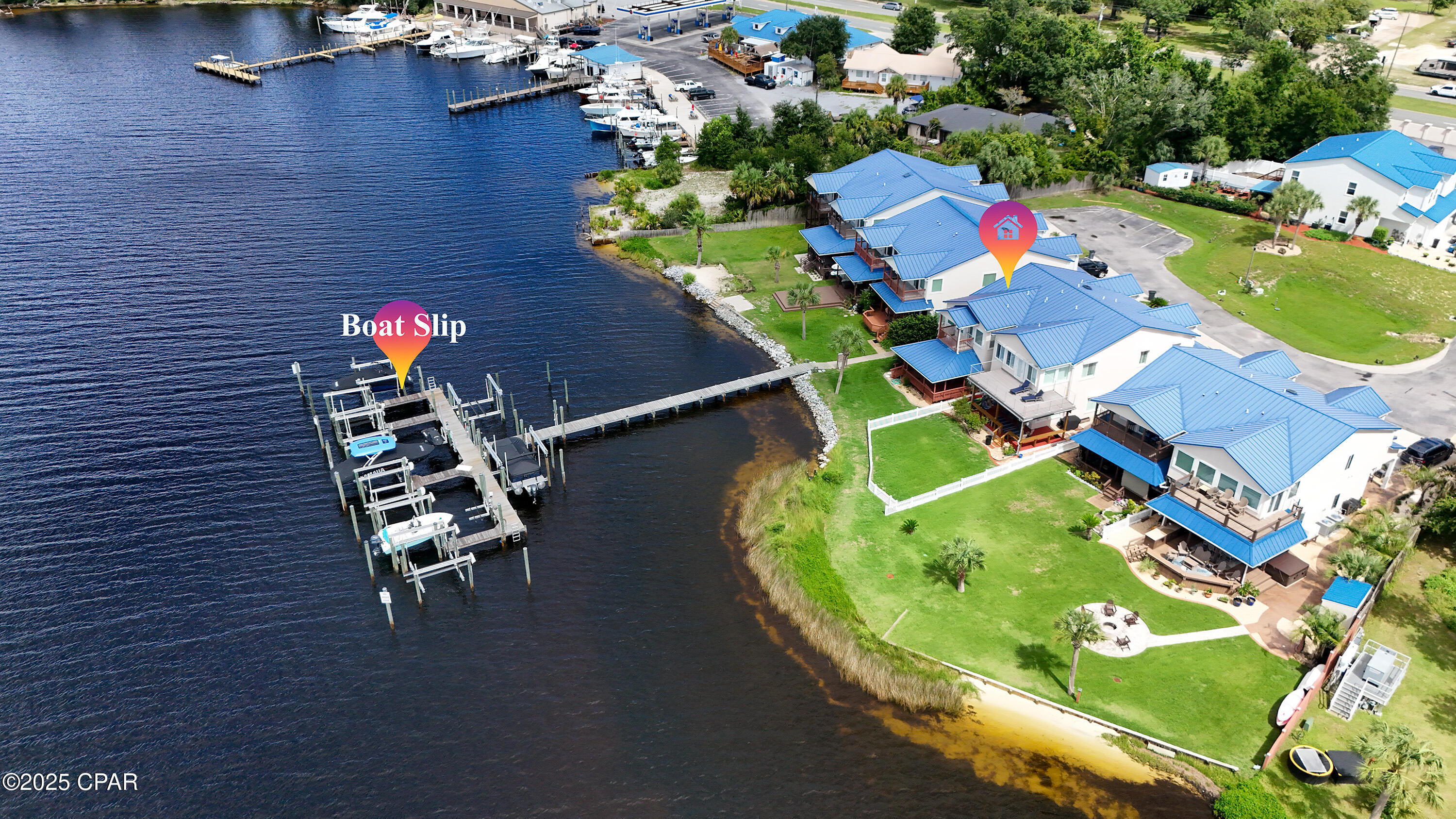 Welcome to Paradice, where you can enjoy beautiful sunsets over Pitts Bayou. This home offers easy access to deep water for boats with a 6-foot draft and includes a 16-foot wide boat slip. A full-service marina is just a quarter mile away. As you enter, you'll find 10-foot ceilings with recessed lighting throughout. The kitchen has dark wood cabinets and granite countertops, with a breakfast bar large enough for four. Just off the kitchen, you will find a full-sized washer and dryer with plenty of shelving behind double doors. The double garage access is located just off the kitchen, which includes an outdoor shower, laundry sink, and shelves on each side with plenty of counter space for all your tools and hobbies; back inside, you will find a half bathroom and a sizable closet. Back through the kitchen, you will find a living area fit for royalty with impressive 10-foot ceilings, upgraded lighting, and a Bay view captured through the large glass sliding doors that lead to a very large covered porch overlooking the Bay and dock, where you will surely enjoy many evenings with your nearest and dearest. Back inside and up the stairs, you will find the waterfront primary bedroom that features a private covered balcony, a vaulted ceiling, a walk-in closet, a soaking tub, and a separate shower, along with two more sizable bedrooms and a full-sized bathroom on the opposite side of the home. This one has it all and is ready for new owners, so call your favorite Realtor today for more information or to schedule a showing.