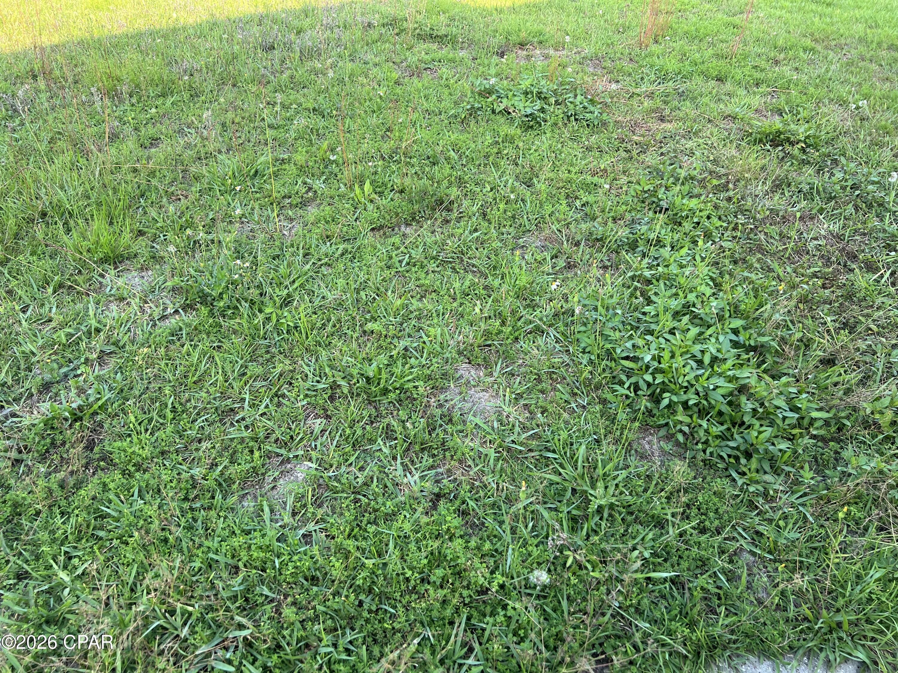 THIS CENTRALLY LOCATED CORNER COMMERCIAL LOT IS AVAILABLE FOR LONG-TERM LEASE. IT IS NEITHER FENCED NOR HAS ANY UTILITIES. 
TERMS AND CONDITIONS ARE FLEXIBLE AND WILL BE FINALIZED BY INTERESTED PARTIES THROUGH THE BROKER.