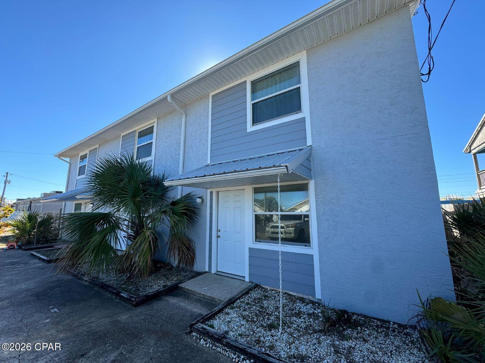 This is a beautiful 2 bedroom, 1.5 bath townhouse just 2 BLOCKS from the WORLDS MOST BEAUTIFUL BEACHES! Recently Renovated. Small deck overlooking the fenced backyard with a peak-a -view of the Gulf, Stainless Steel appliances, Washer and Dryer Connection, with LVP Flooring, right off Thomas Drive. Just a $50 utility fee covers your water/sewer and garbage each month. Please text a photo of your driver's license to our office number along with the name of the property that you are interested in and we will schedule your showing within 1 business day.