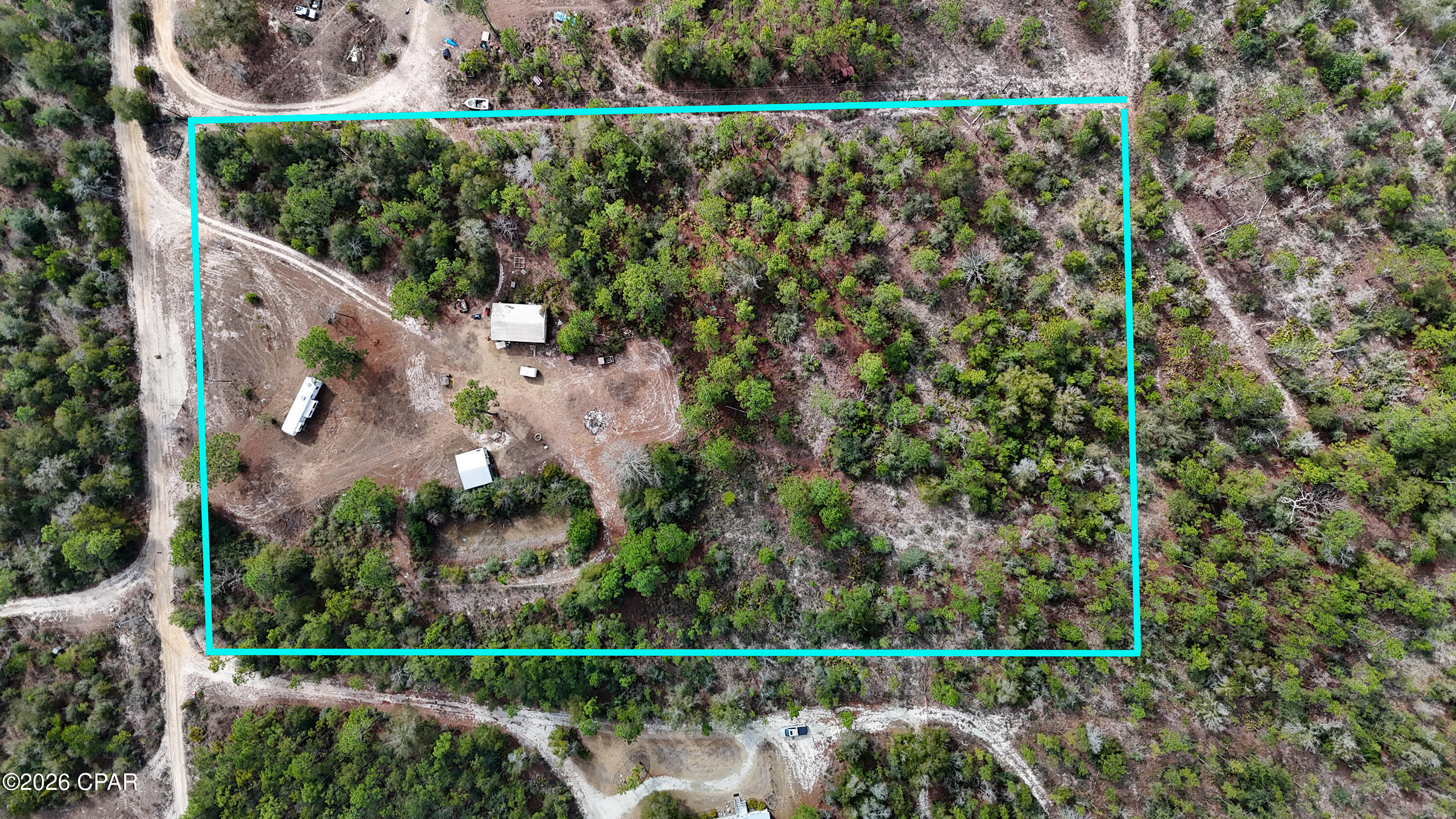 BACK ON THE MARKET - NO FAULT OF THE SELLERS

Beautiful and extremely private 5-acre property in Fountain, FL, featuring a perfect blend of cleared and wooded land. The property offers full-time RV hookups with electric, water, and sewer already in place, along with a tiny home/shed and a 20x30 enclosed pole barn for storage, equipment, or workshop use. Established deer feeders and trails make this an ideal hunting camp, while the seclusion and utilities also lend well to off-grid living. Plenty of room for ATVs, recreational use, or future improvements. A rare opportunity for those seeking privacy, outdoor recreation, and country living.