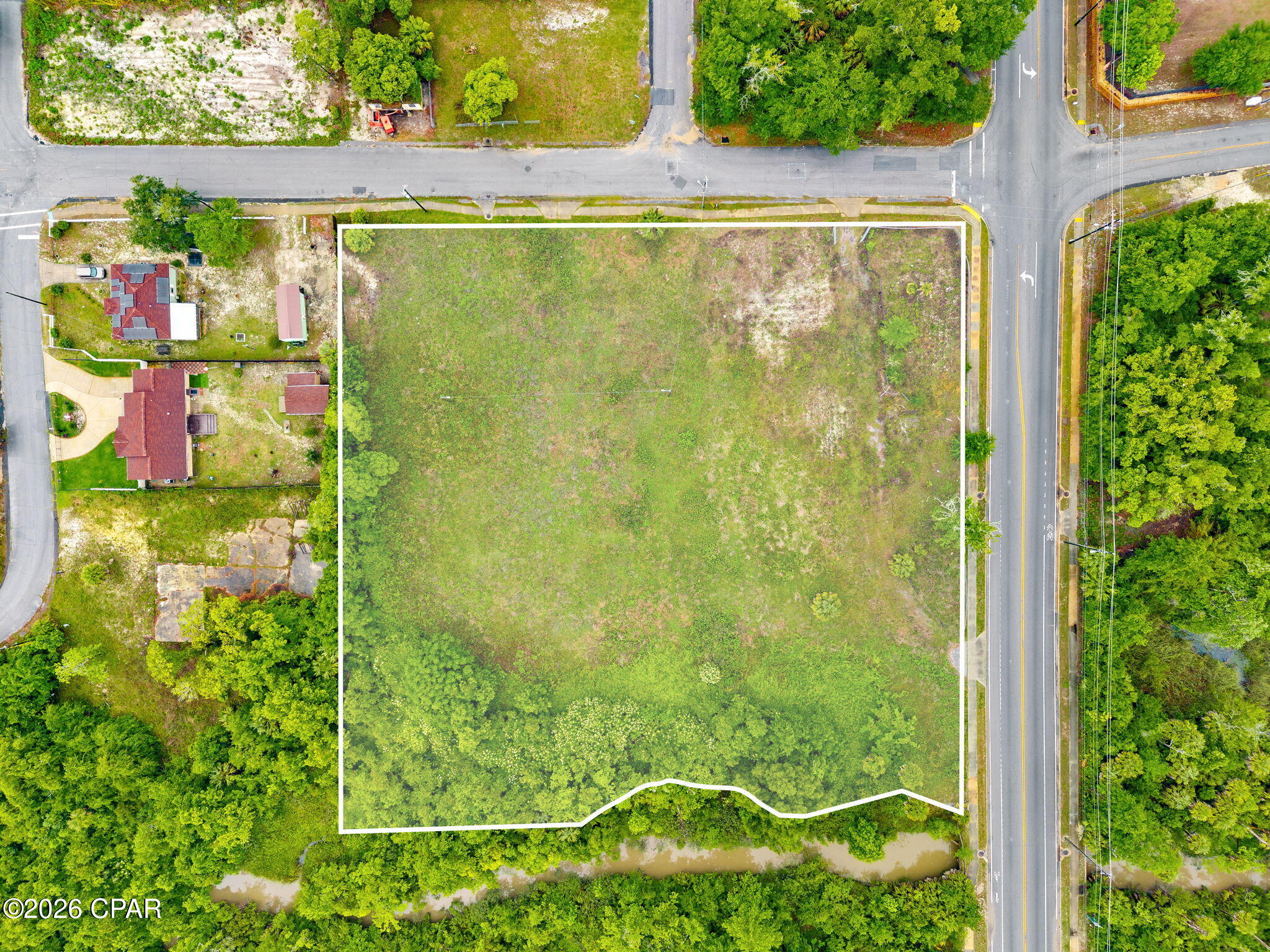 HUGE INVESTMENT POTENTIAL!!
Positioned in a prime location in the heart of Panama City, this exceptional 2.5-acre corner parcel offers unlimited potential for developers, investors, and business owners alike. Located in an opportunity zone. 
Zoned Mix Use 3, the property is ideally suited for medium to high-density residential development combined with professional offices, educational facilities, and low-intensity neighborhood commercial uses. Multifamily development opportunities allow for up to 20 units per acre, creating incredible possibilities for apartments, townhomes, mixed-use concepts, or a live/work community.


Extensive due diligence has already been completed, including an environmental/ecological site assessment, GEO-technical engineering report, boundary and topographical survey, and wetland survey--saving valuable time and expense for future development.


With its highly visible corner location, strong development flexibility, and convenient access to shopping, dining, medical facilities, and major thoroughfares, this parcel is perfectly positioned for growth and long-term value. Whether you are looking to develop multifamily housing, professional office space, educational facilities, or a mixed-use investment project, this property presents a rare opportunity in one of the area's most desirable and rapidly growing locations.
All measurements and items of importance are to be confirmed by buyer or buyer agent.