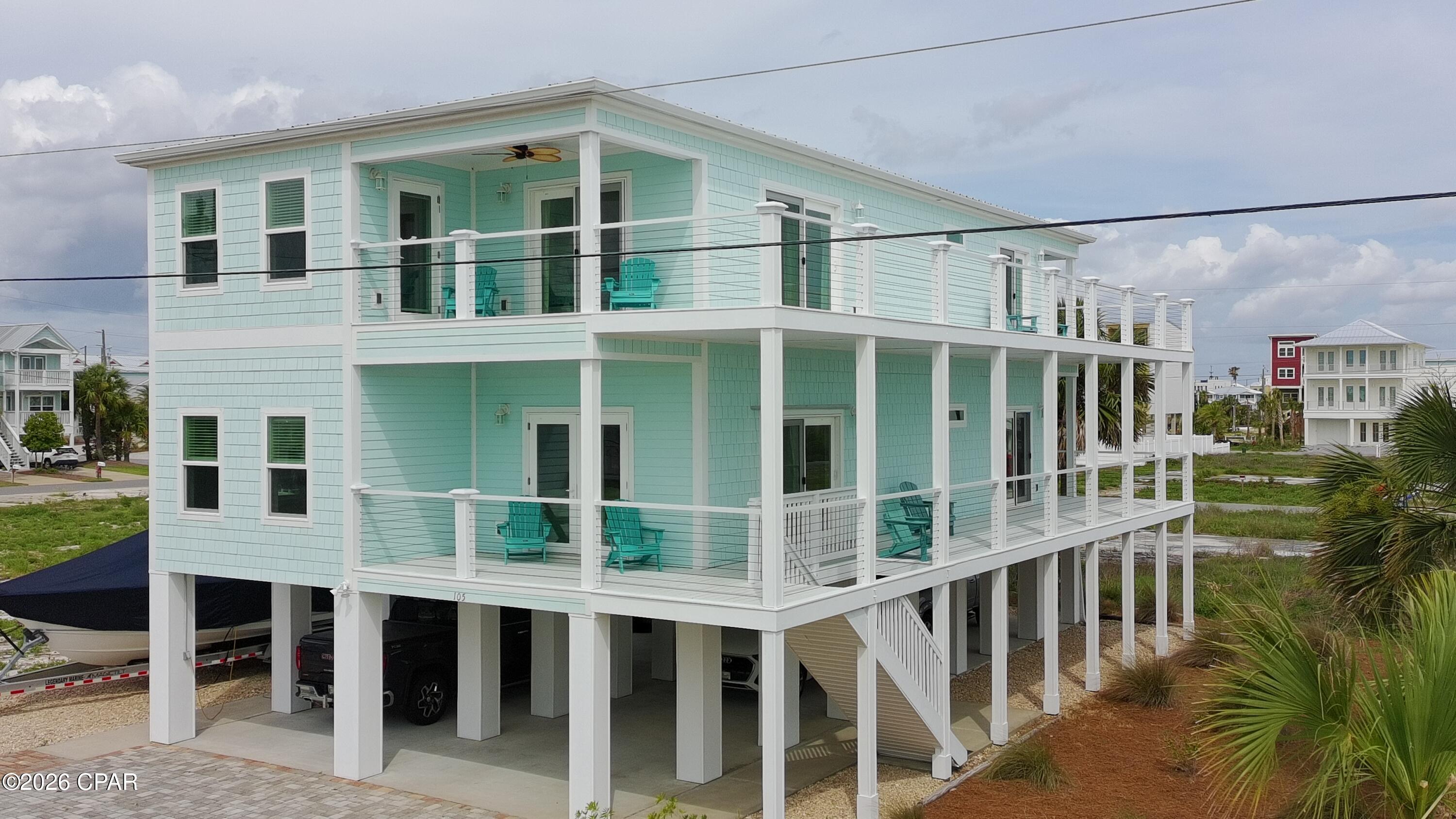 Single-family home built in 2022, built by Affinity with many custom upgrades inside and out. Located on the desirable beachside of Hwy 98 in Mexico Beach. This beautifully designed coastal retreat offers 5 bedrooms, 3 bathrooms, and is positioned approximately 300 steps from the sugar-white sand and emerald waters of the Gulf.

Designed for both personal enjoyment and strong guest appeal, the home is being offered fully furnished (down to linens and kitchenware) and thoughtfully stocked to host many guests, Turn-Key, rental or hosting ready.  The efficient floor plan provides comfortable gathering spaces, privacy for guests, and an easy, low-maintenance beach lifestyle.

Inside, you'll find 9-foot ceilings, crown molding, and a bright coastal feel throughout. The kitchen features Samsung appliances, and the Samsung washer and dryer convey with the purchase, making this a truly Turnkey opportunity. The home also features a generously sized laundry room, Energy Star-rated systems, and a tankless hot water heater with an instant recirculating pump for energy efficiency and near-instant hot water throughout the home.

Two levels of expansive decks offer beautiful Gulf views and create the perfect setting for morning coffee, evening breezes, and relaxing after a day at the beach. Below the home, generous covered space provides parking, storage, and room for beach gear, golf carts, boats, RVs, and more. This lower-level outdoor area extends the fun beyond the walls of the home and is ideal for cornhole, ping pong, yard games, coolers, casual seating, and post-beach gatherings. The outdoor shower makes rinsing off after the Gulf easy and convenient.

Built to current Florida coastal construction standards, the property features impact-rated windows and sliding glass doors, elevated construction, a durable coastal-grade roof, covered parking, outdoor shower, and convenient storage for beach and boating essentials. The home is located in the X Flood Zone and offers enhanced storm resilience.

Located just moments from the Mexico Beach boat slips and boat ramp, 105 Circle Drive offers the ideal combination of beach access, boating convenience, rental potential, and coastal comfort. The City of Mexico Beach owns and rents canal slips nearby by the day, week, month, or year. These 12-foot-wide slips accommodate many fishing boats, including boats with upper stations and towers.

This custom-finished, single-family residence offers the privacy and flexibility today's coastal buyers are looking for -- no shared walls, no attached neighboring homes, and no HOA fees. Circle Drive is one of the quieter streets in Mexico Beach, tucked away from Hwy 98 road noise and perfectly positioned behind the marina for peace, privacy, and a relaxed beachside feel with over 1500 square feet of deck.

Short-term rentals are permitted, yet the area maintains a quieter coastal atmosphere that appeals to full-time residents, second-home owners, and vacation buyers alike. Positioned on one of the few streets in Mexico Beach that is not a straight front-to-back roadway, the property also offers added ease for maneuvering boats, trailers, and golf carts.

Mexico Beach is loved for its sugar-white sand, emerald water, and laid-back ''Old Florida'' charm without the crowds, high-rises, or heavy traffic found in larger beach destinations. Families, second-home owners, and vacation renters are drawn here for the slower pace, beautiful beaches, boating, fishing, and strong sense of community. Conveniently located, Mexico Beach also offers easy access to Port St. Joe and Panama City for dining, shopping, entertainment, and travel convenience.