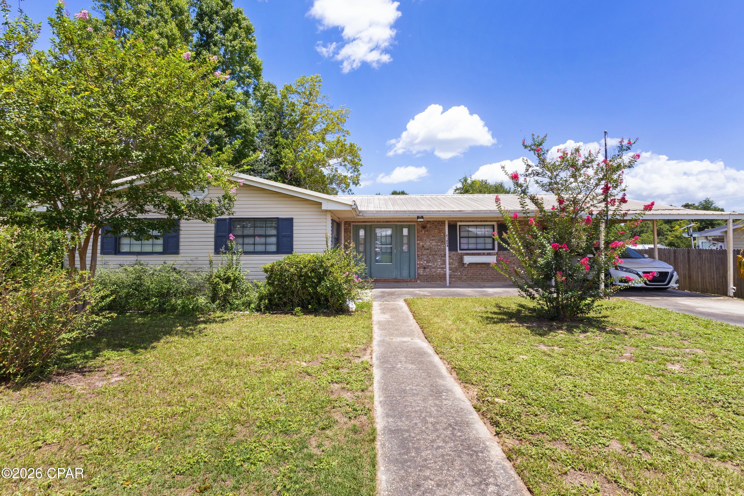 Welcome to this spacious 3-bedroom, 2-bath home located in the desirable Sunny Hills community! The property is located on three lots totaling over half an acre-including a desirable corner lot. This home also features a versatile bonus room with windows and a closet, perfect for a Florida room, home office, or potential fourth bedroom. A separate oversized laundry room provides additional storage and functionality.

This property offers exceptional outdoor space and flexibility. Outside, you'll find a covered carport plus a detached garage and large workshop/shed, offering plenty of room for vehicles, hobbies, equipment, or extra storage.

Conveniently located near Boat Lake and Gap Lake, with access to Sunny Hills' beautiful 18-hole golf course, this property offers the perfect blend of small-town charm and outdoor recreation. With generous living space, multiple outbuildings, and endless potential, this is a fantastic opportunity to make this property your own.