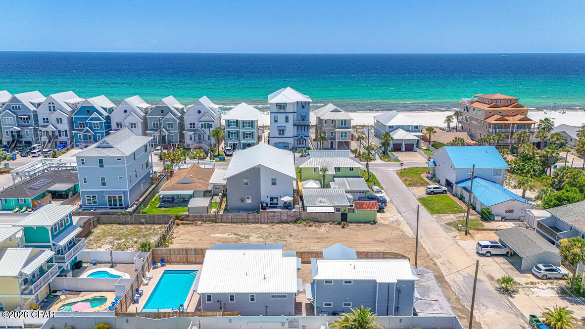 Rare PCB Beach Compound 4109&4111 Marlin St| 3 Residences • One Parcel • Two Lots from the Beach • Heated/Chilled Pool • Sleeps 18-20 • Fully Furnished & Turnkey. with effective build date June 2026

Rare opportunities like this simply don't exist anymore. Just two lots from the beach, this one-of-a-kind Panama City Beach compound offers three separate residences on one parcel--a beautifully rebuilt two-story duplex with two 2-bedroom, 1-bath residences and a stunning 3-bedroom, 2-bath main home centered around a private resort-style heated and chilled pool. Combining location, flexibility, and the quality of new construction, this is a truly rare opportunity in one of Panama City Beach's most desirable vacation rental corridors.

Professionally reconstructed and completed in June 2026, this is far more than a renovation. Thoughtfully rebuilt by the owner--not a builder flip--the property was designed specifically for luxury vacation rentals with an emphasis on quality, longevity, energy efficiency, and exceptional guest experience. Every detail was intentional, from the 10-foot ceilings in the main home and custom 8-foot hurricane-rated doors to the impact-rated windows and doors, custom transom windows, smart LB siding, designer coastal finishes, custom-built bunk rooms, and durable low-maintenance materials throughout.

Designed to comfortably accommodate 18-20 guests, the compound is ideal for large family vacations, multi-generational gatherings, corporate retreats, or premium vacation rental operations. The resort-style outdoor living area features a new heated and chilled swimming pool, two grilling stations, expansive paver decking, and a hot and cold outdoor shower, creating an exceptional space for relaxing and entertaining after a day at the beach.

Operational efficiency was equally important. Each residence has its own electric meter, each building has its own water meter, and the property includes a dedicated owner's closet, making ownership and management simple and efficient. Six off-street parking spaces provide ample room for owners and guests.

Located in the highly sought-after Lower Grand Lagoon area, you're just a short walk from the beach and minutes from St. Andrews State Park, Shell Island excursions, marinas, waterfront dining, shopping, and entertainment. Leave the car behind and enjoy one of the most walkable and desirable beach locations on Panama City Beach.

Situated in Flood Zone X no flood insurance needed and offered fully furnished and completely turnkey, this exceptional property is ready for immediate personal enjoyment or income-producing vacation rental operation from day one.

Properties offering three fully rebuilt residences on one parcel this close to the beach are exceptionally rare and increasingly difficult to replicate. Built to be owned--not flipped--this extraordinary beach compound reflects thoughtful planning, premium materials, and craftsmanship rarely found in today's investment properties.