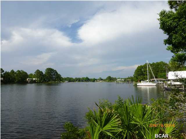 WATER FRONT HOME ON CALLAWAY BAYOU! This spacious 4 Br, 2.5 bath tri-level home sits on a large sloping lot with great elevation and offers fabulous view across the bayou. Ready for move-in. RECENT UPGRADES include all new floor covering, freshly painted interior, new vanities and fixtures in the bath rooms, new shower doors, freshly painted garage etc. On the entry level you will find a large inviting foyer with polished slate floor, a den with water view and an adjoining screened porch, a small office, the laundry room, a 1/2 bath and access to the 2 car garage. Go up half a level and you find yourself in the large living room with brick fireplace and a huge window that lights up the room, a formal dining room, the kitchen with view of the water and a breakfast area that is
