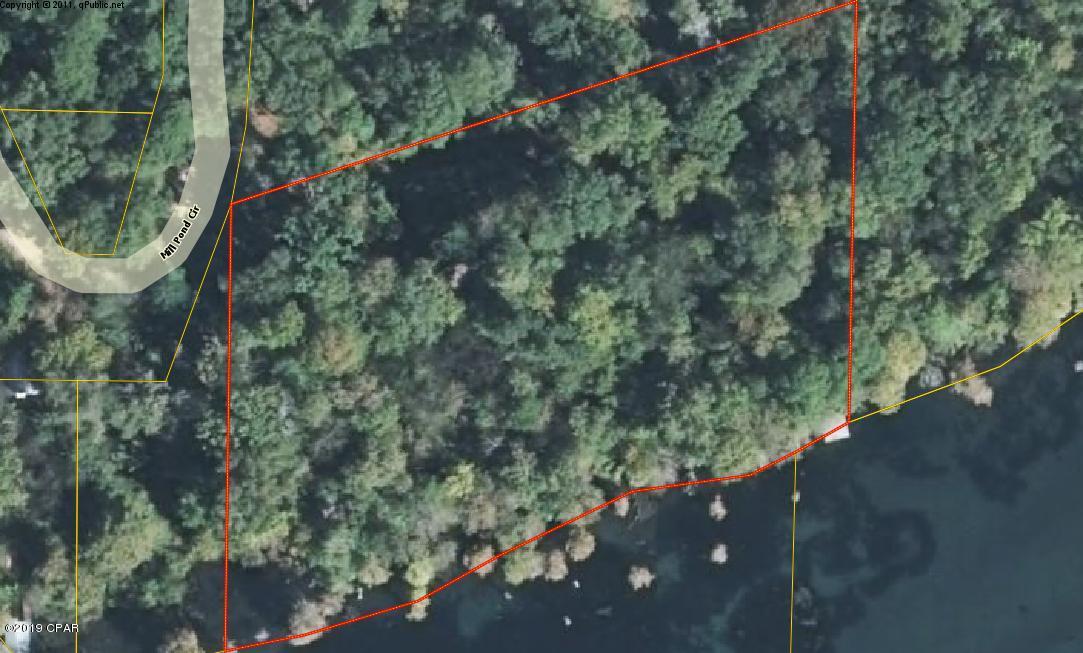 WATERFRONT ON THE MILLPOND!!!  This is two and a half acres with over 400 feet on the Mill Pond and a dock.  It has Indian Wash Tub spring in front of this property and this place is beautiful.  Does have some trees down from the Hurricane.