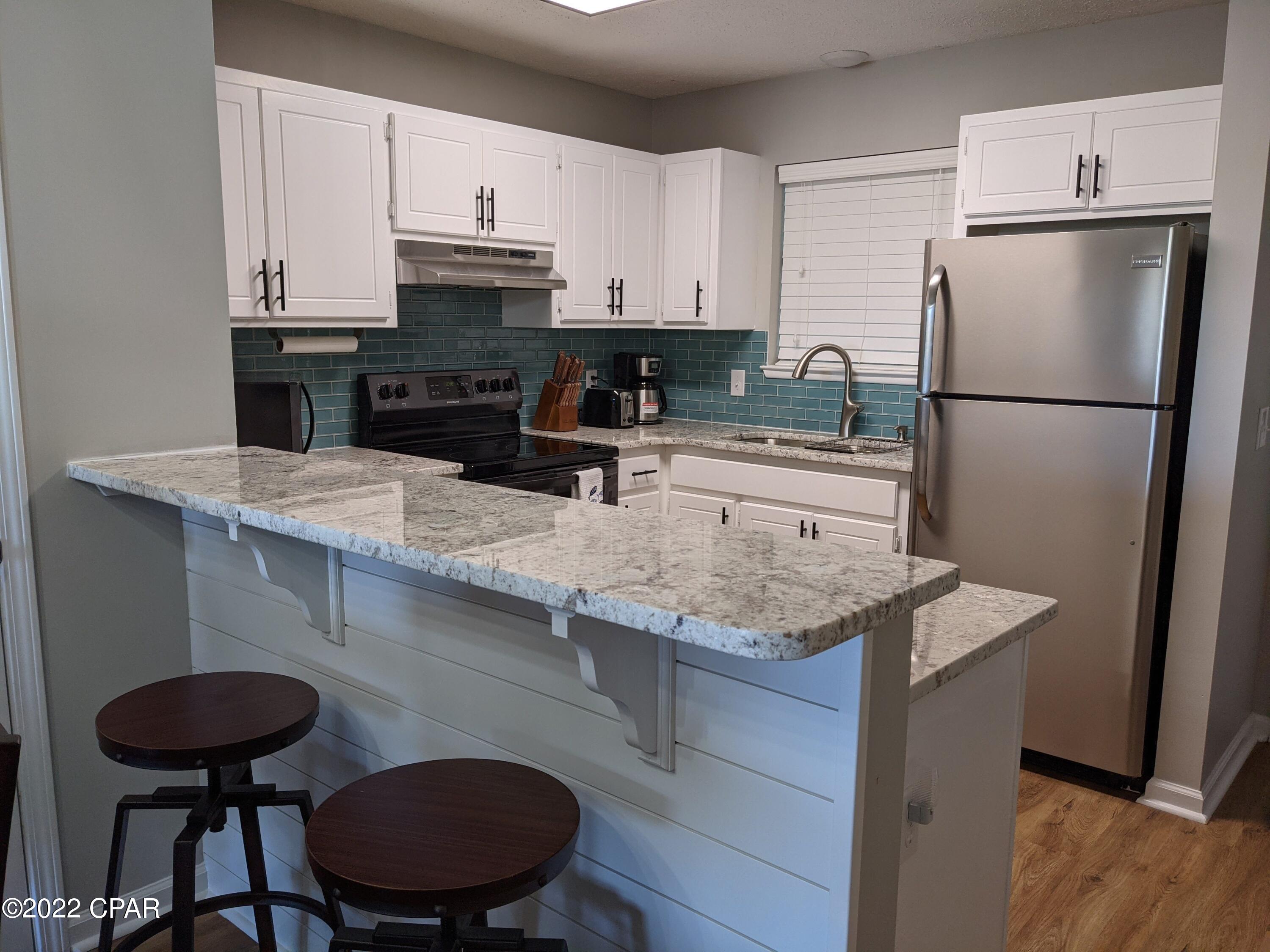 Remodeled, low density condo, directly across the street from the Beach. This unit was remodeled in 2020 and features new stainless steel appliances, granite counters, LVP floors and remodeled bathrooms. Water Heater and AC were replaced in March of 2021. Unit offers two dedicated covered parking spaces. And an observation deck on top for owners. All furniture, linens and kitchen tools are included. This unit is truly a rental machine. It has grossed over 50k YTD on Air BNB and has a 4.93 on 83 reviews as of this listing. 



This small HOA keeps things easy. The HOA fee includes water, cable and trash. The building was recently painted, and the driveway repaved. The roof was redone after hurricane Michael.