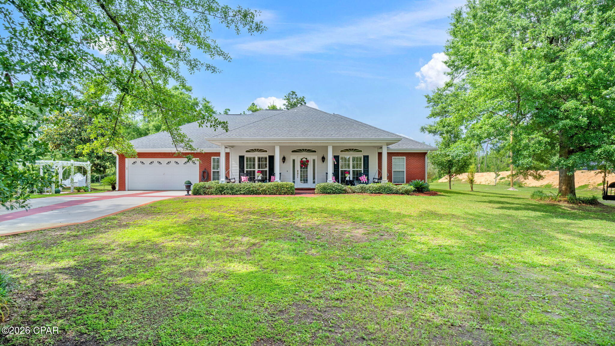 Unique properties like this one do not come around often. Set on a beautifully maintained 1.842 acre corner lot, this custom built 3 bedroom 2.5 bath home is the total package. 
The main home features an open concept split bedroom floor plan, polished concrete floors, and built in cabinetry in the family room. The kitchen is well appointed with custom cabinetry, high end appliances, granite countertops, soft close drawers, and plenty of storage. Behind the main home sits a private one bedroom one bath guest house, perfect for extended family or additional living space, with the potential to add a second bedroom down the road. The carriage house with its own kitchenette offers even more flexibility and could easily serve as a home office, fitness room, craft room, or storage space.
Outside you will find a pergola, new fencing, and gorgeous grounds that give the entire property a peaceful and private feel. Select furnishings will convey and most are negotiable. This is a one of a kind opportunity with multiple structures, room to grow, and endless potential.