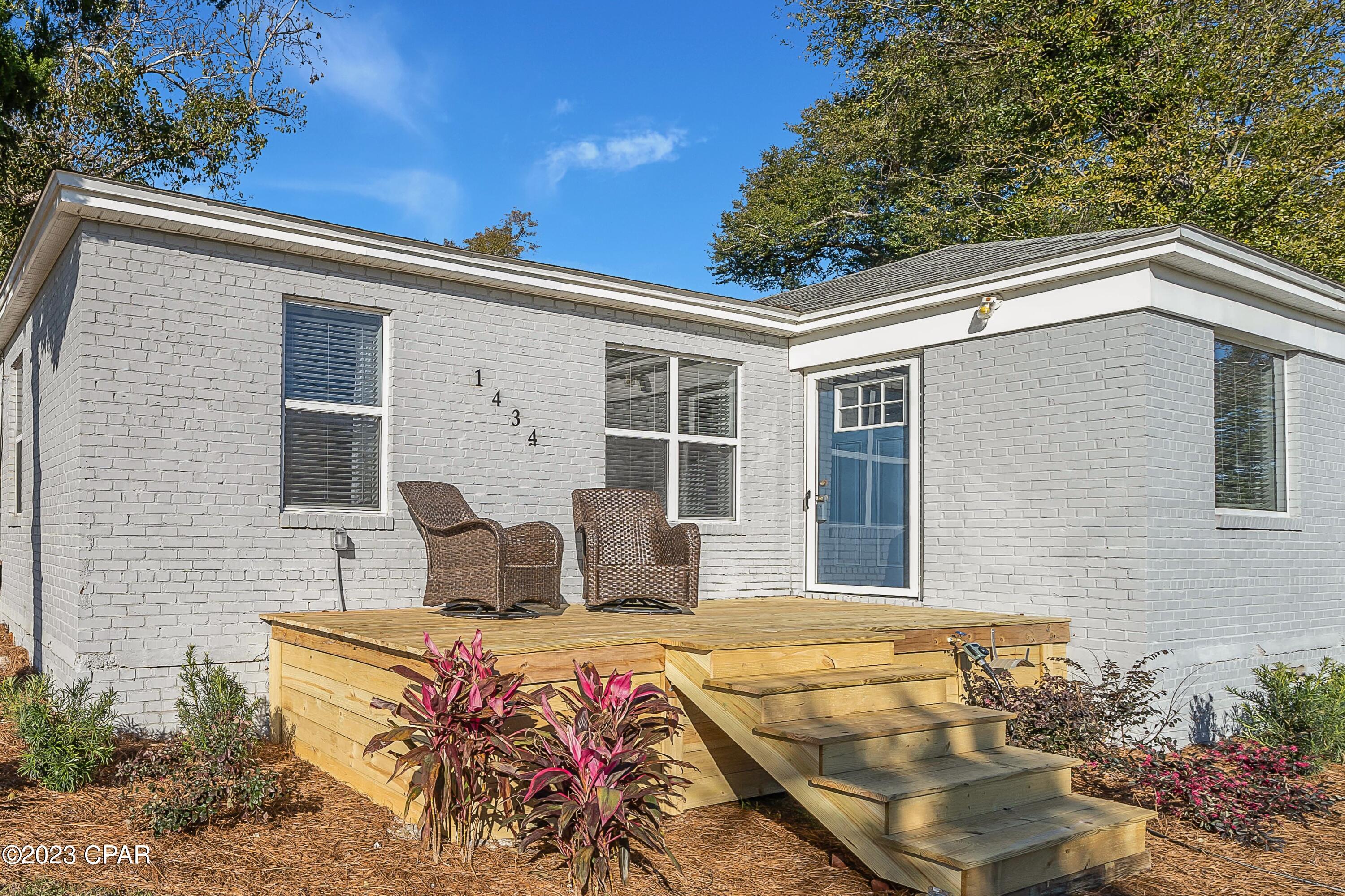 'CURRENTLY UNDER CONTRACT, SELLER WILL CONSIDER BACKUP OFFERS' Welcome to St. Andrews!   Just three blocks from the St Andrews Bay this 1942 Florida Cottage with three Bedrooms and two Full Baths sits on a beautiful newly landscaped corner lot.  A short walk from your front door offers White Sand Bay Beaches, Beautiful City parks, and miles of popular walking and biking routes.   

The home features updates throughout including: LVP flooring, a full walk-in laundry room, ceiling fans, large windows, and a brand-new front deck with great views. The kitchen has original features that have been nicely updated with modern amenities including: stainless steel appliances, Granite countertops, and original cabinets. The spacious living room includes an oversized brick fireplace and mantle.  The yard is partially fenced with a concrete foundation that once held a 2-car garage however, with a little work it could be a nice place to store your kayaks, paddle boards, and bikes or build that income producing Accessory Dwelling Unit you have always wanted.  Call your favorite Realtor® today and "Live the Dream".