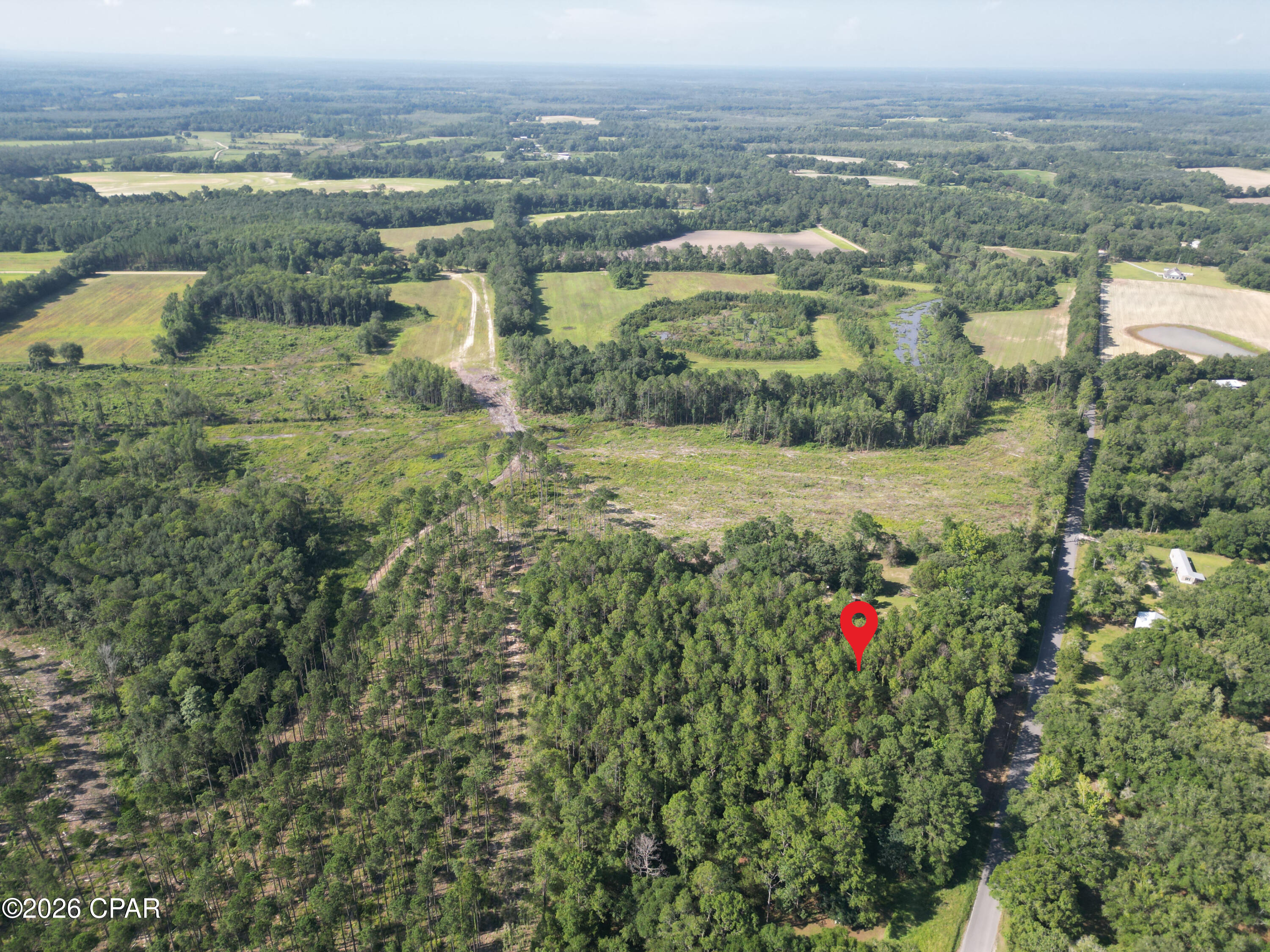 Get ready to experience the freedom of country living on this exceptional 3 +/-acre wooded parcel on scenic Beall Packing Road in Holmes County, Florida. Featuring a beautiful mixture of mature oak and pine trees, the land provides natural privacy, shade, and the charm of Old Florida. With approximately 260 feet of paved road frontage, you'll enjoy easy access while still appreciating the quiet surroundings and slower pace of country life.
This high and dry, unrestricted property offers endless possibilities. Build your custom dream home, bring in a mobile home, establish a mini homestead, or create the hobby farm you've always wanted. With plenty of room for gardens, workshops, barns, and outdoor recreation, you'll have the space and flexibility to truly make it your own.  
The local recreational opportunities are exceptional in this area!  Spend the day swimming, snorkeling, or scuba diving in the crystal-clear waters of Morrison Springs, one of Northwest Florida's most beautiful freshwater springs, located just minutes from the property. Enjoy family outings and year-round 68-degree spring-fed swimming at Ponce de Leon Springs State Park, where nature trails and picnic areas provide the perfect setting to relax and unwind. For those who love life on the water, the Choctawhatchee River and Holmes Creek are both a short drive away and offer outstanding opportunities for boating, freshwater fishing, and kayaking.  Whether your passion is fishing, paddling, swimming, hiking, or simply enjoying the outdoors, this property gives you some of the Florida Panhandle's most treasured recreational destinations right at your fingertips.
Whether you're looking for a private homesite, a country retreat, or an investment in Northwest Florida land, this beautiful acreage offers the rare combination of natural beauty, convenience, and unrestricted living.  If you've been searching for a place where you can enjoy the peace of the countryside with the freedom to live life your way, this Holmes County property is ready to bring your vision to life. Call today for more information.
Key Features:
• 100% high and dry
• Approximately 260 feet of paved road frontage
• Mature mixture of oak and pine trees
• Peaceful and quiet rural setting
• No HOA and no known deed restrictions
• Build a custom home or bring a mobile home
• Horses and farm animals welcome
• Plenty of room for a hobby farm, workshop, garden, or outdoor activities
• Approximately 25 minutes to Ponce de Leon Springs State Park
• Easy access to the Choctawhatchee River for boating and fishing