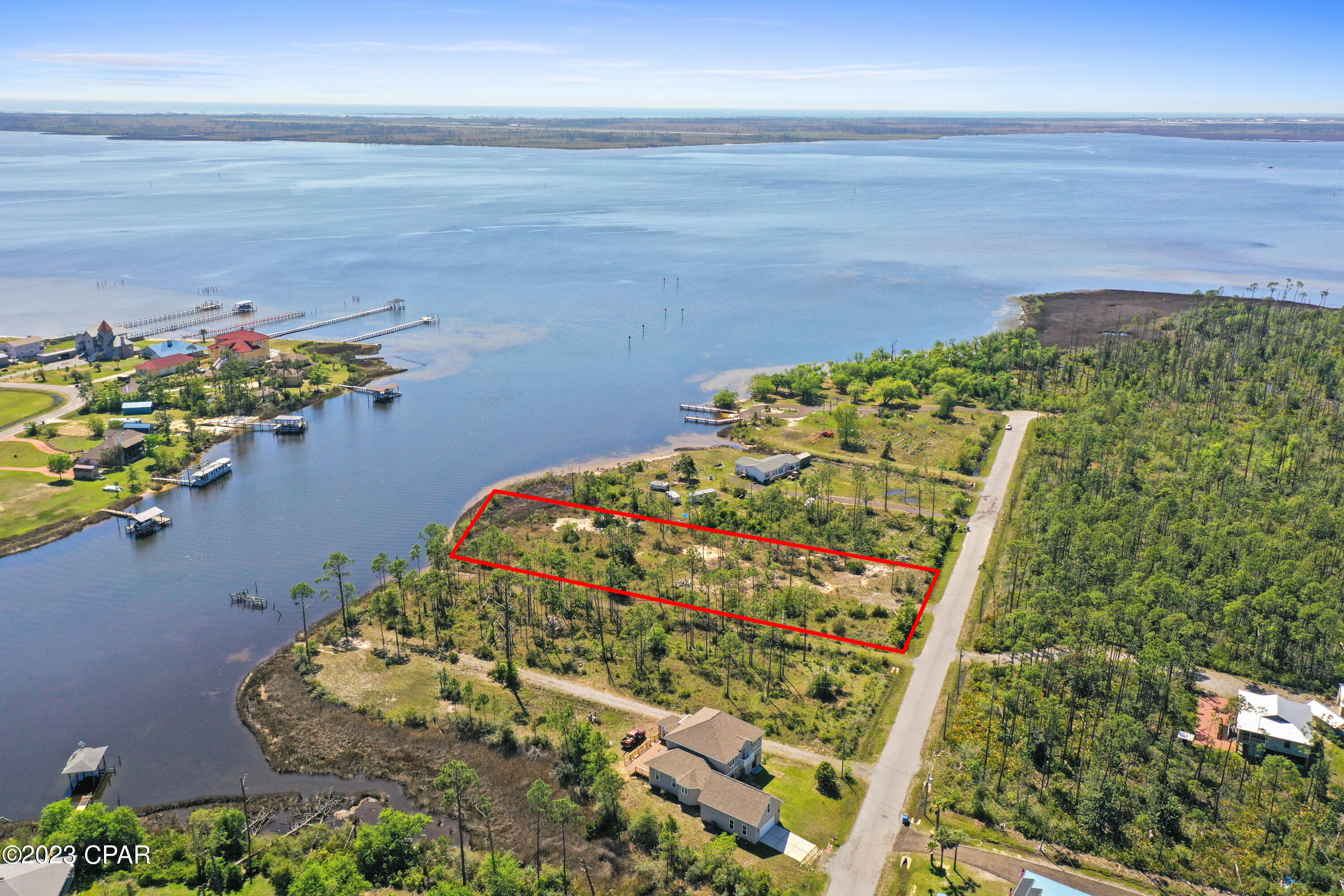 BEST PRICED WATERFRONT LOT with OVER 1 ACRE of land with DEEPWATER ACCESS. This beautiful lot is located at the mouth of Richard Bayou and features gorgeous views of East Bay and the Intercoastal Waterway. Build your DREAM, WATERFRONT HOME in this peaceful area and enjoy endless breathtaking sunrises and sunsets on the Bay, and the freshest seafood you can get straight from your backyard. No long docks needed to access the deep water with this great lot. Call your Realtor TODAY to  get started on your waterfront dream home.