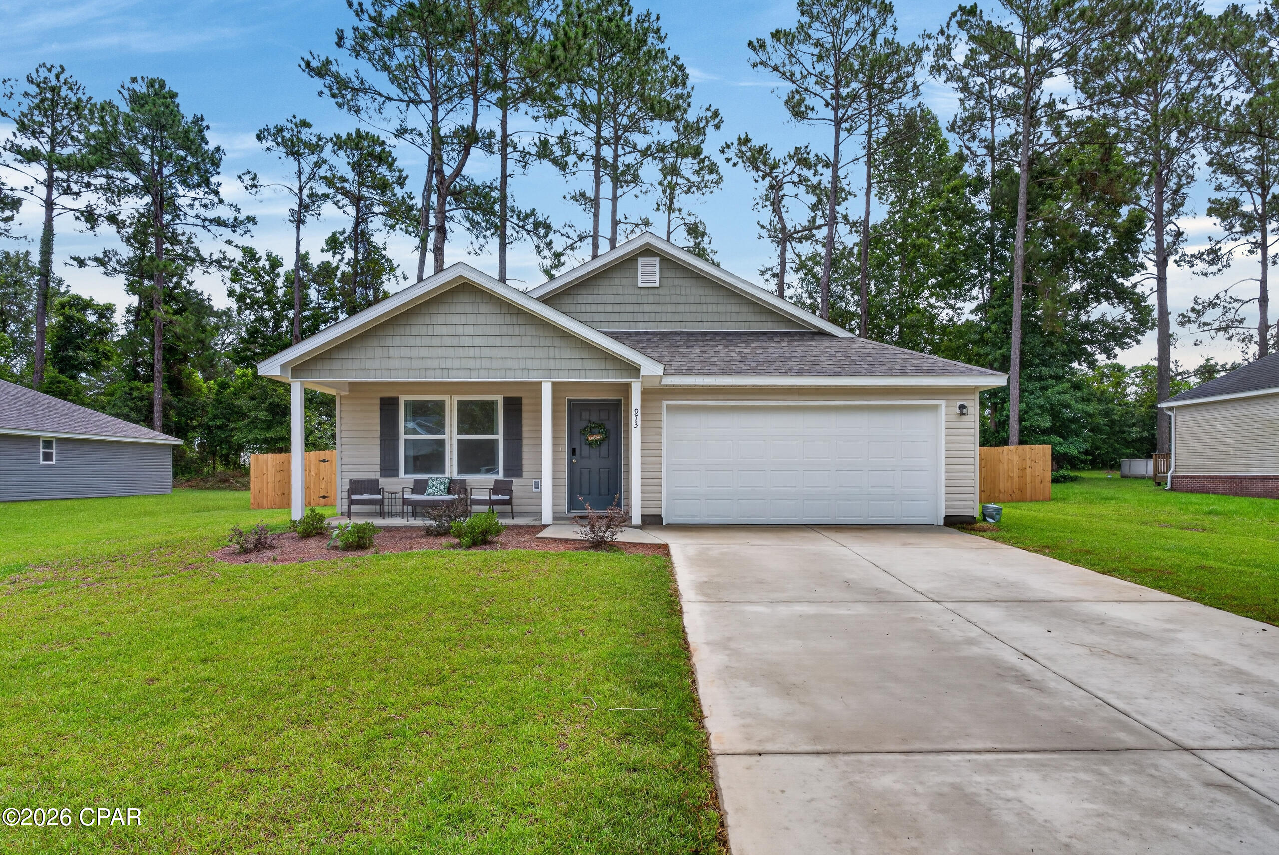 Welcome to this beautifully designed 4 bedroom, 2 bathroom home located in the desirable Martin's Woods community. This home offers a functional layout with modern finishes throughout, including a stylish kitchen featuring shaker cabinets, granite countertops, and stainless-steel appliances, including an electric smooth-top range, microwave hood, and dishwasher.

The primary suite provides a comfortable retreat with a private bath, dual vanity sinks, and a spacious walk-in closet. Three additional bedrooms and a well-appointed secondary bathroom offer plenty of room for family, guests, or a home office. Enjoy outdoor relaxation on the patio overlooking the fenced backyard, perfect for pets, play, or entertaining.

Additional features include Low-E insulated dual-pane vinyl windows for energy efficiency and a two-car attached garage for added convenience. Conveniently located just minutes from town, this home offers easy access to the hospital, shopping, restaurants, and everyday essentials while still enjoying the peaceful setting of a welcoming neighborhood.