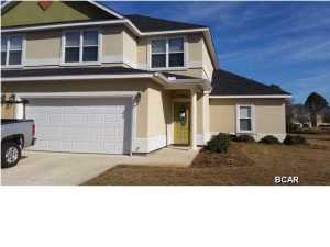 5 minutes to THE WORLD'S MOST BEAUTIFUL BEACHES!!This gorgeous 4 bedroom 3 and half bath END UNIT has 2 Master suites and overlooks the lake and pool. 1 Master downstairs, with Large walk-in closet,garden tub, double vanity. Great room with dining area. Kitchen with breakfast bar, pantry and large closet. Upstairs has Large Master with double vanity, Large walk in closet garden tub. 2 additional bedroom and bath, plus large pantry on 2nd floor. All furnishings can be included at a negotiated price. Exterior painting is also covered, as well as all walls out. Maintenance also includes mowing and landscaping. 25 minutes to Panama City International Airport and 10 minutes from Pier Park, movie theatre, golf, restaurants and everything your family desires for entertainment and