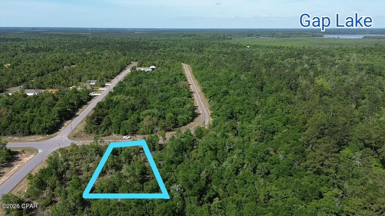 Discover the perfect canvas for your Florida lifestyle on this spacious 0.398-acre parcel in the desirable Sunny Hills community in Chipley, FL. Nestled in a peaceful, growing subdivision, this level lot offers ample space to design and construct your ideal single-family home, with room for outdoor living, gardening, or future expansions. Sunny Hills is a golfer's and nature lover's paradise, featuring an acclaimed 18-hole golf course at Sunny Hills Golf Club with wide fairways and large greens that provide enjoyable play for all skill levels. Residents enjoy access to a scenic boat lake, a swim park, multiple additional lakes ideal for fishing or swimming, and community parks for relaxation and recreation. The community is experiencing exciting growth, with multiple reputable builders actively constructing new homes, bringing fresh energy and modern residences to the area. Convenience is at your doorstep with a Dollar General market right at the entrance of one of the main boulevards, making everyday errands effortless. Location is unbeatable: Just 30 minutes from the charming city of Chipley for shopping, dining, and services, and under an hour's drive to the stunning white sands and emerald waters of Panama City Beach perfect for weekend getaways or day trips to the Gulf Coast. Whether you're seeking a peaceful retreat surrounded by natural beauty or a vibrant community with endless outdoor amenities, this lot in Sunny Hills offers the ideal blend of tranquility, recreation, and convenience. Don't miss your opportunity to secure a piece of Florida Panhandle paradise.