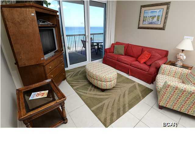 Unit 707 is a one bedroom/two bathroom condo (with bunks) at the spectacular Sunrise Beach Resort. The unit is completely tiled throughout and comes fully furnished and rental ready in an upscale, contemporary decor. Both the master bedroom and the living room feature glass sliding doors that open up to the over sized gulf-front balcony - offering sweeping vistas of ''The World's Most Beautiful Beaches'' all around you. In addition to the spacious master bedroom, a separate bunk room provides far more privacy and a superior layout to the standard ''bunks in the hallway'' floor plan. The master bathroom features double vanity sinks, a lovely garden tub and a separate shower. Owner financing considered with healthy down payment. equipped kitchen is absolutely ideal for a unit of this size and features white, newer appliances and beautiful white cabinetry, plus granite counter tops for an aesthetically striking effect overall. The washer and dryer conveys with the unit, as does an owner's closet for keeping personal items secure if renting the unit. Sunrise Beach Resort is one of Panama City Beach's most desirable condominiums, thanks in part to its fantastic location close to Pier Park, plus its huge variety of terrific amenities. Owners and guests can enjoy 2 gulf-side swimming pools, 2 spas, children's water play area, and a barbecue area with gas grills. Sunrise Beach also features four levels of covered parking under the building, which is a real plus and not typically offered at most condominiums in the area. Unit 707 is currently the only one bedroom unit for sale at this time within Sunrise Beach Resort, and subsequently the best priced unit per square foot! This is a highly competitive price and will make a wonderful investment thanks to a seasoned rental history. Alternatively, this condo is as good as it gets for a vacation getaway - a home away from home where the family can kick back and relax directly on the beach. The balcony was made for taking in sunsets together and the unit is ready and waiting for memories to start being made.