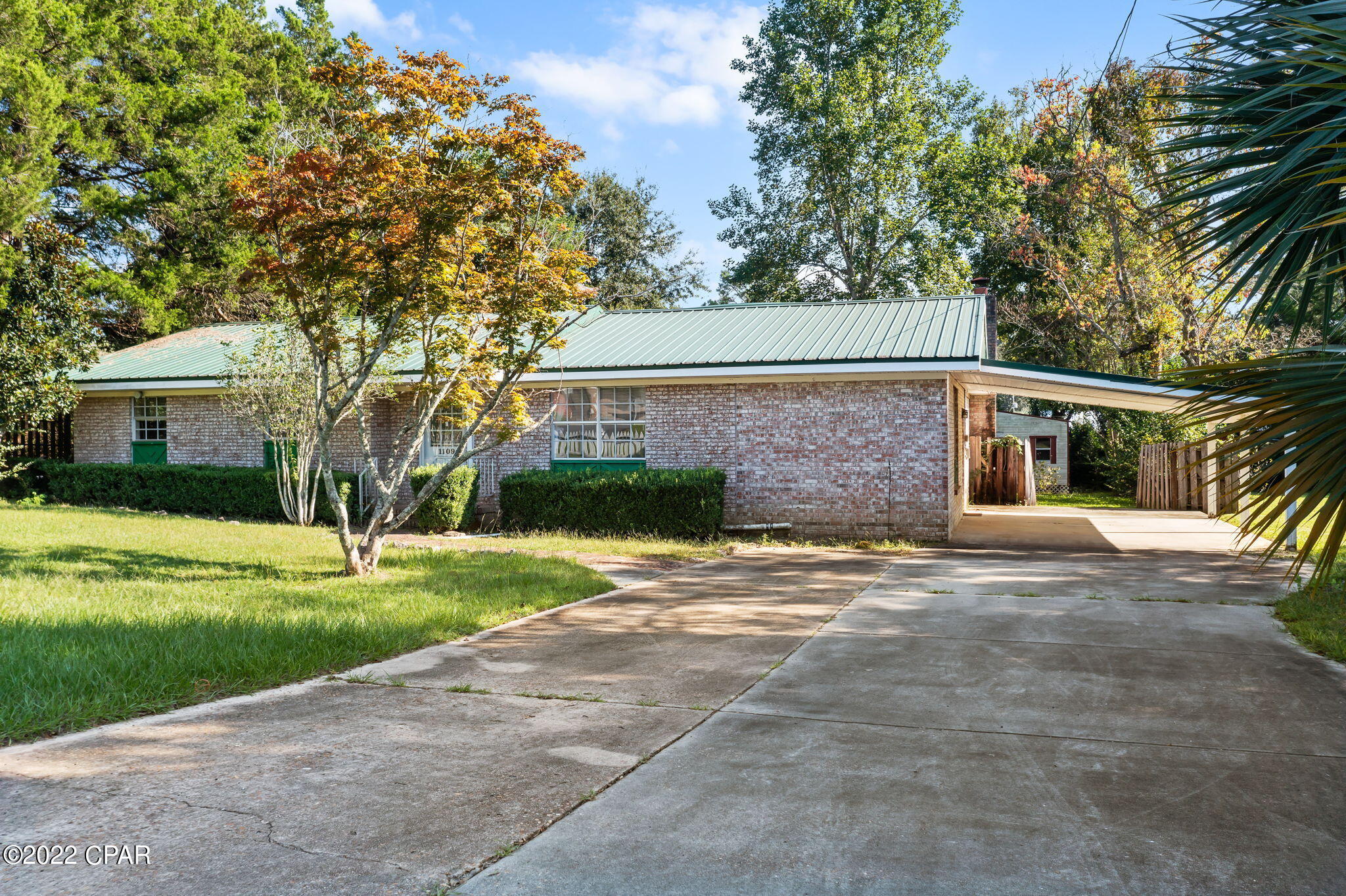 The possibilities are endless with this four bedroom home.  This home is situated on a paved road inside the Graceville city limits.  The exterior of this home is brick with a metal roof.  The home is an entertainers dream with plenty of space.  Just off the living area is a dining room open to the kitchen.  There is also a large family room on the back of the home.