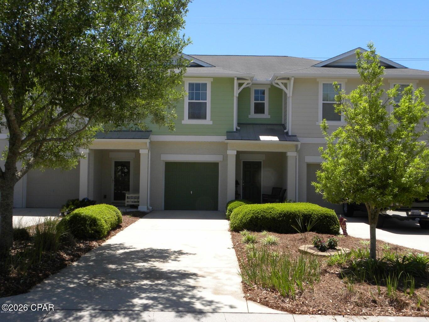 Welcome to 109 Sand Oak Boulevard located in the desirable Whisper Dunes community on the west end of Panama City Beach! This 3-bedroom, 2.5-bath townhome offers a fantastic opportunity for buyers looking to add their own personal touches and build instant value. Priced to sell AS IS, this property is ready for a little TLC including fresh paint and new carpet -- making it an excellent option for primary residence buyers, investors, or anyone seeking an affordable beach-area property with great potential. The functional floor plan features a spacious living area, covered front porch, and a 1-car garage with two additional driveway parking spaces. Additional features include a new roof in 2024. Out back, enjoy a private patio area ready to be transformed into your own outdoor living retreat -- perfect for relaxing or entertaining. Residents of Whisper Dunes enjoy a pet-friendly community with beautiful landscaping and mature trees throughout, along with a community pool and pavilion/gazebo. Conveniently located near the beaches, Pier Park, dining, shopping, and local attractions, this home offers value, location, and opportunity all in one. With a little TLC, this property has the potential to truly shine.