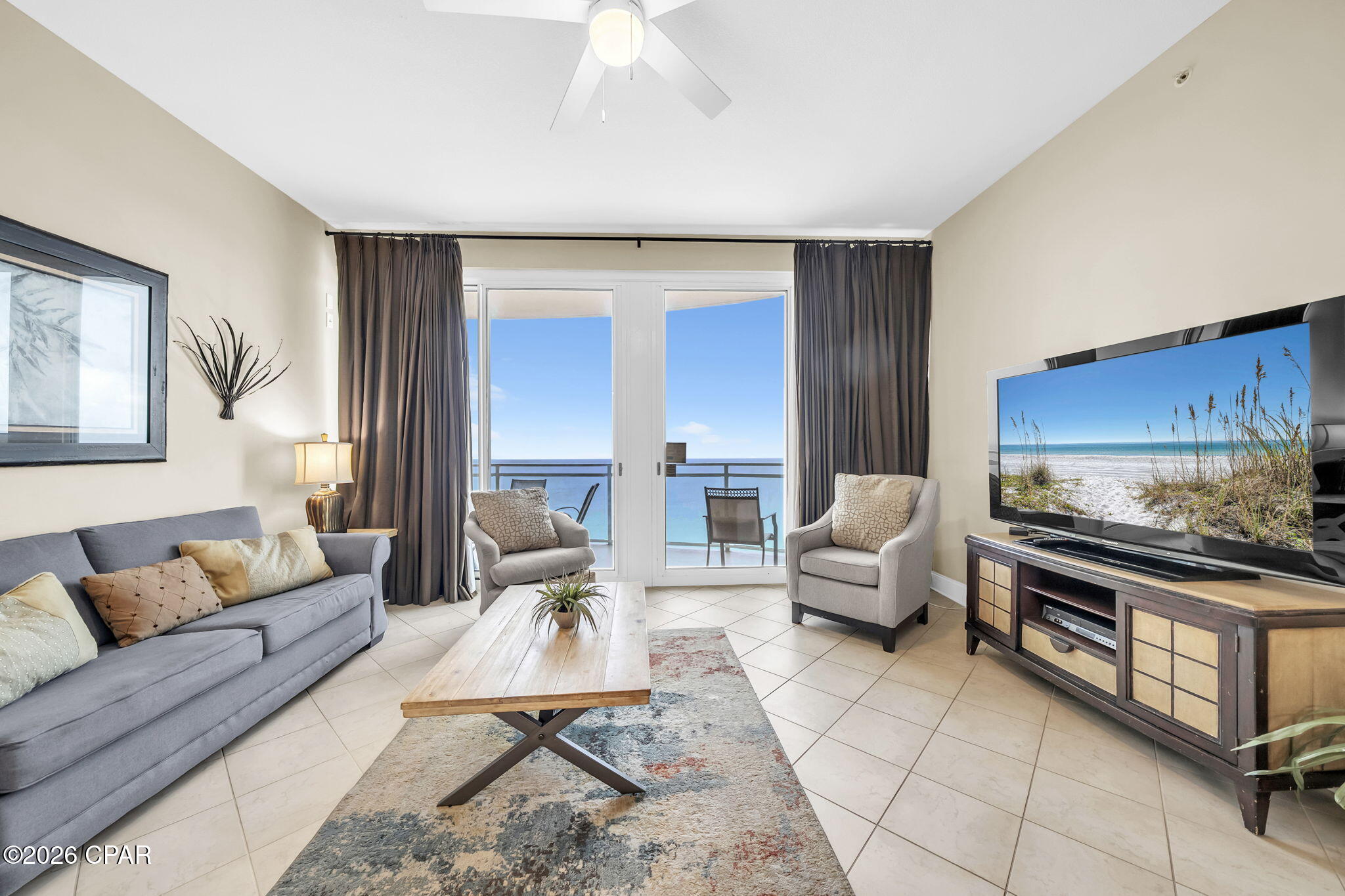 Wake up to breathtaking views from this stunning beachfront penthouse in the heart of Panama City Beach at Aqua!  Featuring 2 bedrooms, 2 bathrooms, plus a bunk area to comfortably sleep 6-8 making it perfect for family, guests, and rental income.

Soaring 10 ft ceilings and expansive windows fill the space with natural light while showcasing incredible coastal views. Thoughtful window treatments provide both style and privacy. The open-concept layout creates a spacious and inviting atmosphere, making it easy to relax or entertain after a day at the beach.
Large dining area with seating for 6 plus breakfast bar with additional seating for 3 along with a well-equipped kitchen make meal preparation and entertaining a breeze.  The unit also has a full-size washer/dryer for everyday convenience. 

Residents and guests enjoy resort-style amenities including pools (1 partially indoors), spa/hot tub, fitness center including steam room, event spaces, and the ease of direct access to the beach.  You'll also love the convenience of having Paparazzi Pizza onsite for a quick bite and covered parking with an elevated walkway.  Located just minutes from Pier Park's shopping, dining, and entertainment including Dolly Parton's Pirate Voyage dinner show, Topgolf, and other popular nearby attractions making Aqua a favorite destination for guests who return year after year. Book your private showing today!