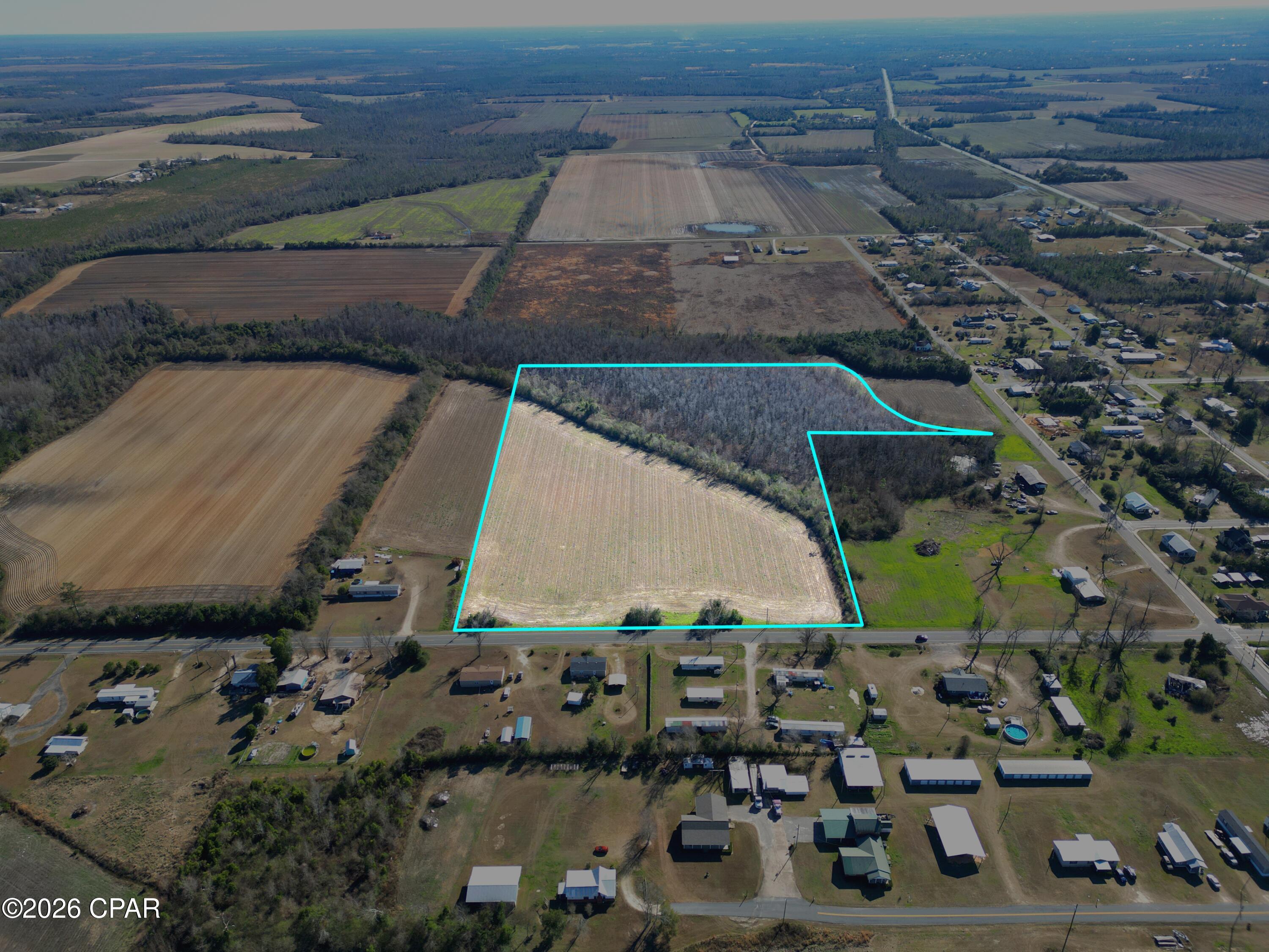 Are you looking for a place to build your dream home?  Or possibly a perfect place to build a subdivision?  This is the one.  This 15 +/- acre property is located in the city limits of Altha, with close proximity to city water, sewer, and power.  Walking distance to Altha School.  Fifteen minutes to Marianna, FL.  Only an hour from Panama City and Tallahassee Airports for easy commuting and an hour to the world's most beautiful beaches in Mexico Beach.  If you are wanting to relocate to Florida, this property offers you country living with quick access to surrounding cities.  Call today to set up a showing.  Will split property into 2 parcels (Lot 1 - 9+/- acres, Lot 2 - 6 +/- acres)