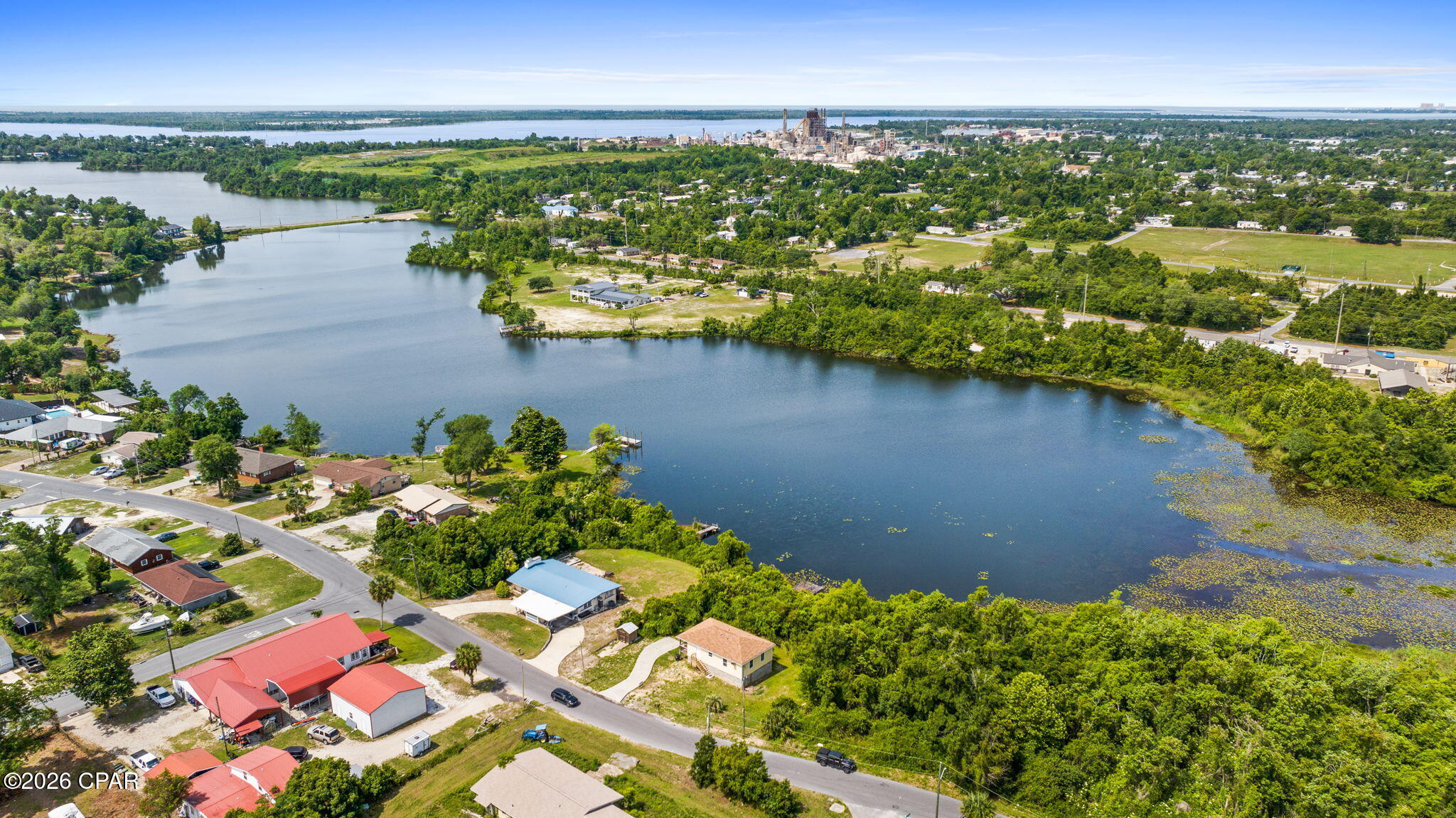 257 Arlington Drive offers a great opportunity to enjoy waterfront living on beautiful Martin Lake while still being close to everything the area has to offer. Located in an established neighborhood in Panama City, this property combines peaceful lake views with a convenient central location that makes everyday living easy. Inside, the home has a warm and comfortable feel with natural light throughout and plenty of space to make it your own. The layout works well for everyday living, hosting family and friends, or simply relaxing after a long day. Whether you are searching for a primary residence, second home, or investment opportunity, this property offers flexibility and potential. The outdoor space is what truly makes this property stand out. Step into the backyard and enjoy direct waterfront access to Lake Martin, creating the perfect setting for fishing, kayaking, relaxing by the water, or enjoying the sunset in the evenings. Imagine starting your mornings with coffee overlooking the lake and ending your day with peaceful water views right outside your door. There is plenty of room for entertaining, outdoor gatherings, or creating your own private lakeside retreat. One of the biggest advantages of this home is its location. The property is conveniently located just a short drive from Tyndall Air Force Base, making it a great option for military personnel or anyone wanting quick access to the base. You are also only minutes from downtown Panama City, where you can enjoy local restaurants, shopping, marinas, community events, and waterfront dining. The nearby community of Callaway provides even more convenience with grocery stores, schools, parks, and everyday essentials close by. For those who love the beach, Panama City Beach is within easy reach, giving you quick access to white sand beaches, entertainment, dining, and some of the area's most popular attractions. This location truly gives you the best of both worlds with a peaceful waterfront setting and convenient access to work, recreation, and entertainment. Waterfront homes with this kind of location, potential, and lifestyle do not come around often. Whether you are looking for a place to call home full time, a weekend escape on the water, or an investment property in a growing area, 257 Arlington Drive is ready for its next chapter.